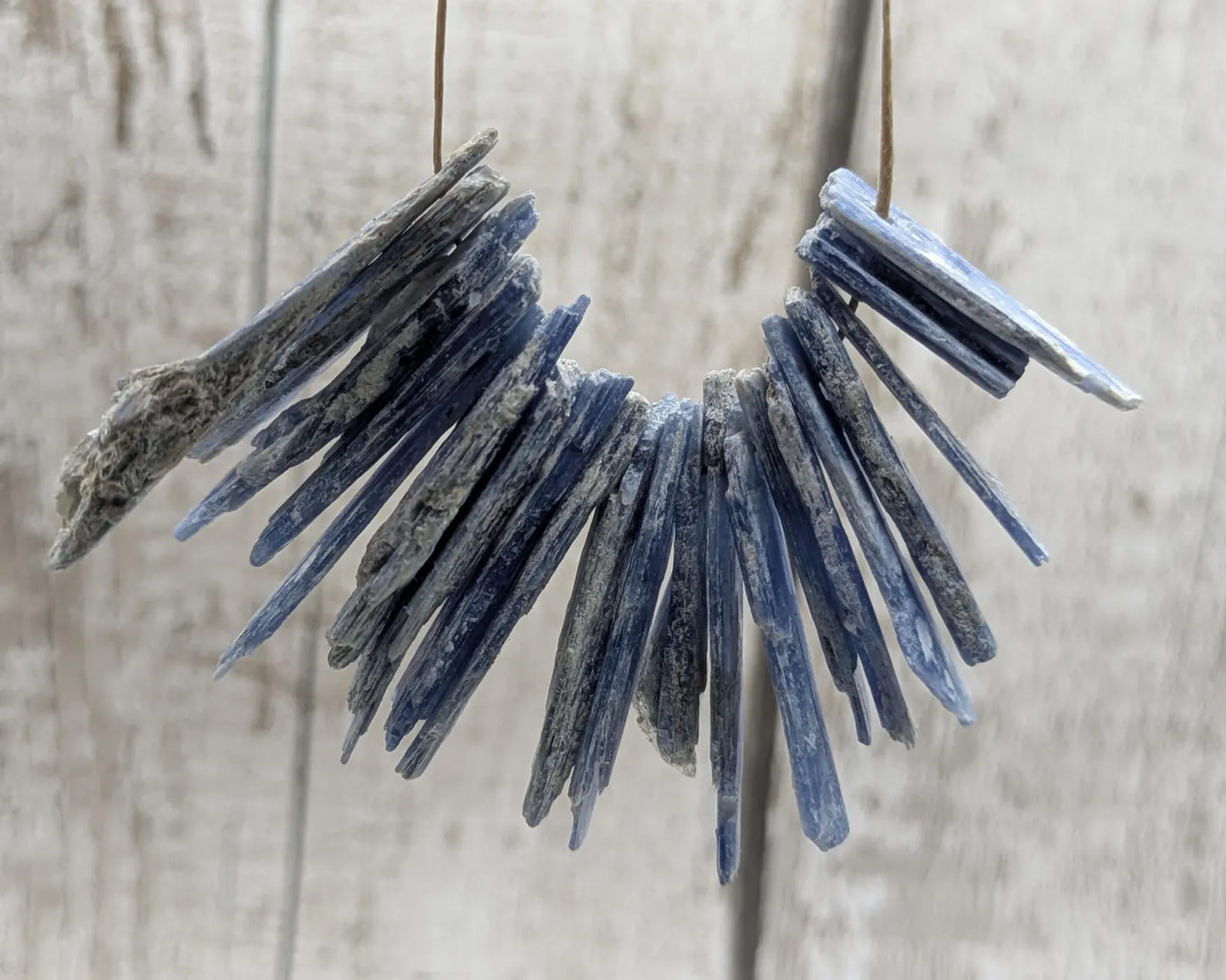 18 small blue kyanite beads.