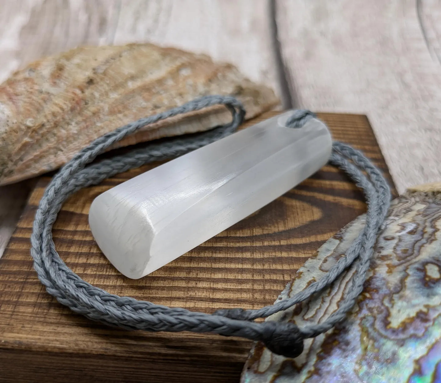 Selenite satin spa Hei Toki adze pendant.