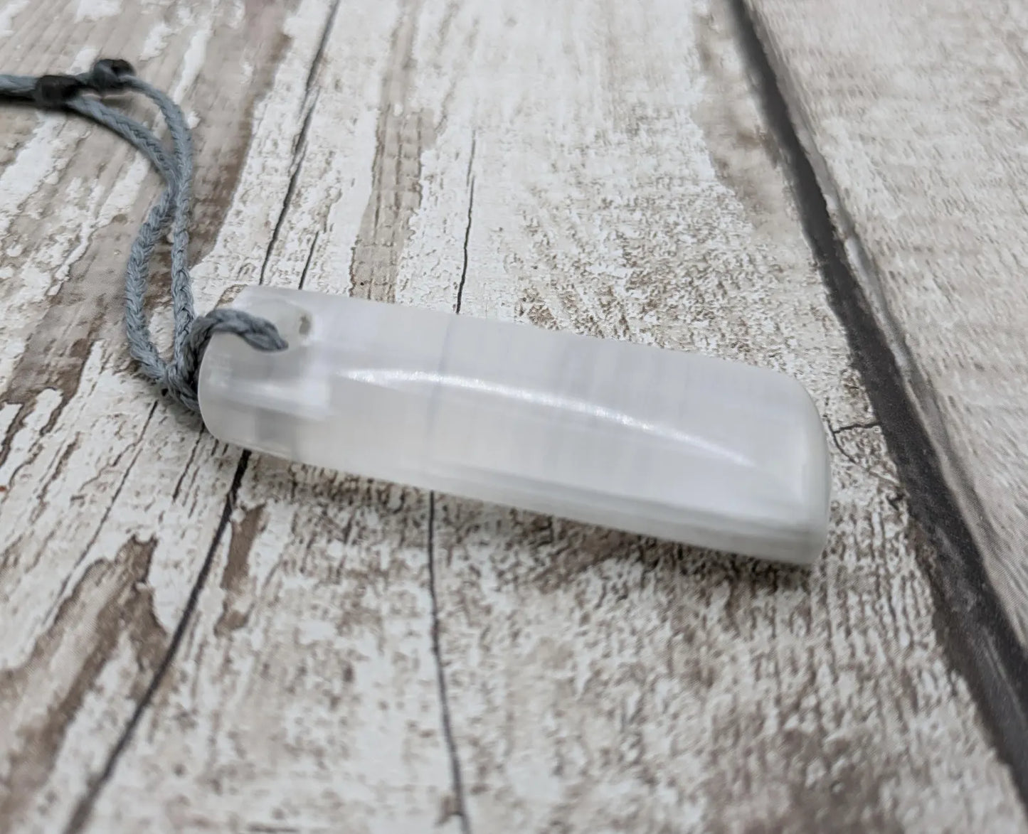 Selenite satin spa Hei Toki adze pendant.