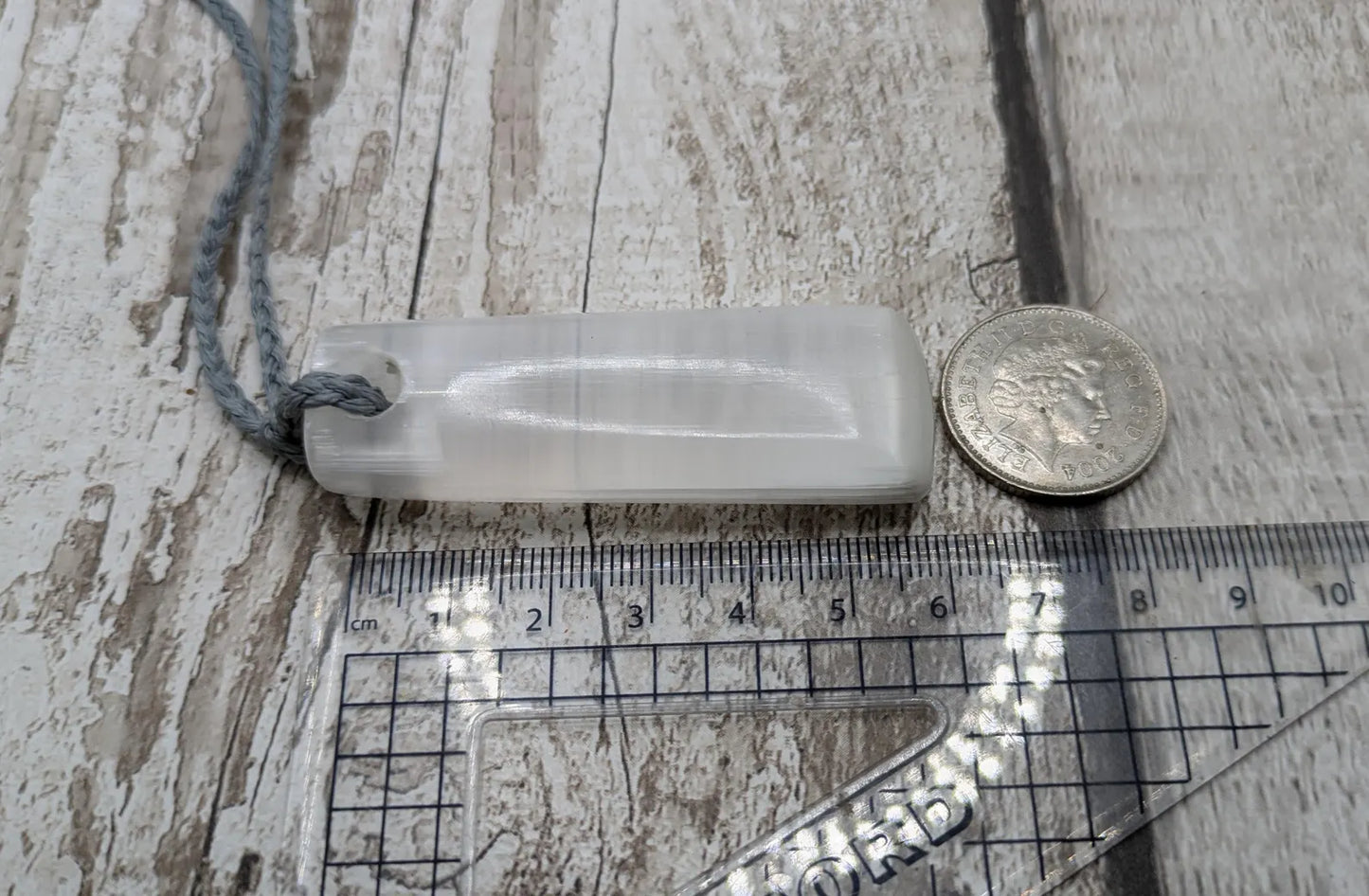 Selenite satin spa Hei Toki adze pendant.