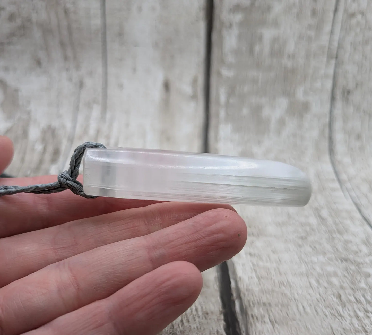 Selenite satin spa Hei Toki adze pendant.