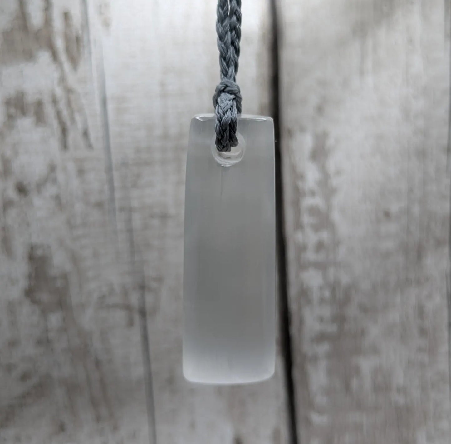 Selenite satin spa Hei Toki adze pendant.