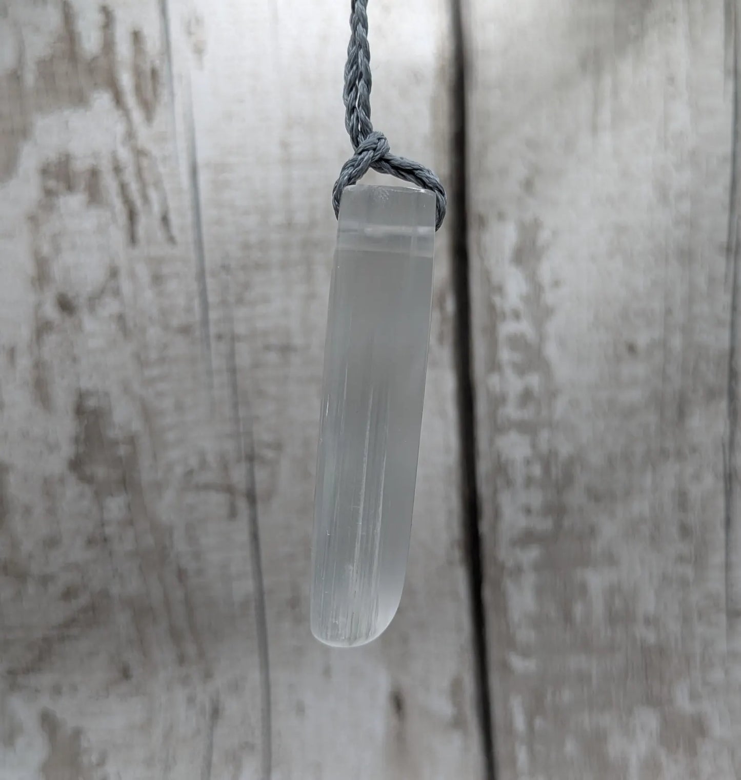 Selenite satin spa Hei Toki adze pendant.