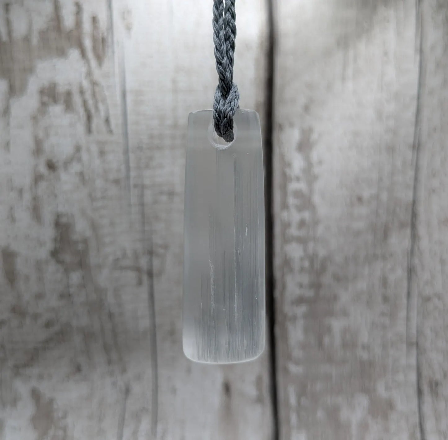 Selenite satin spa Hei Toki adze pendant.