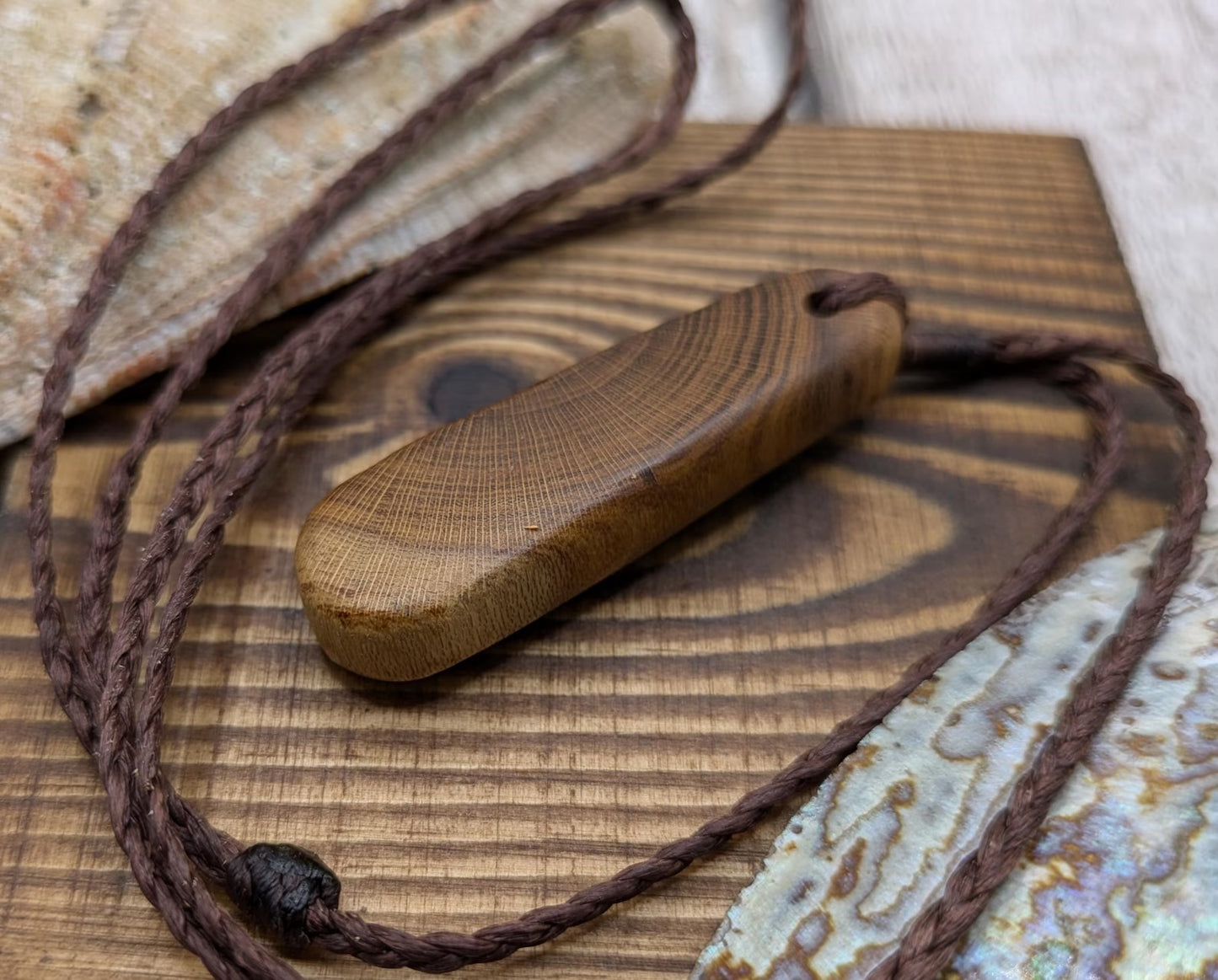 Laburnum wood roimata tear drop pendant.