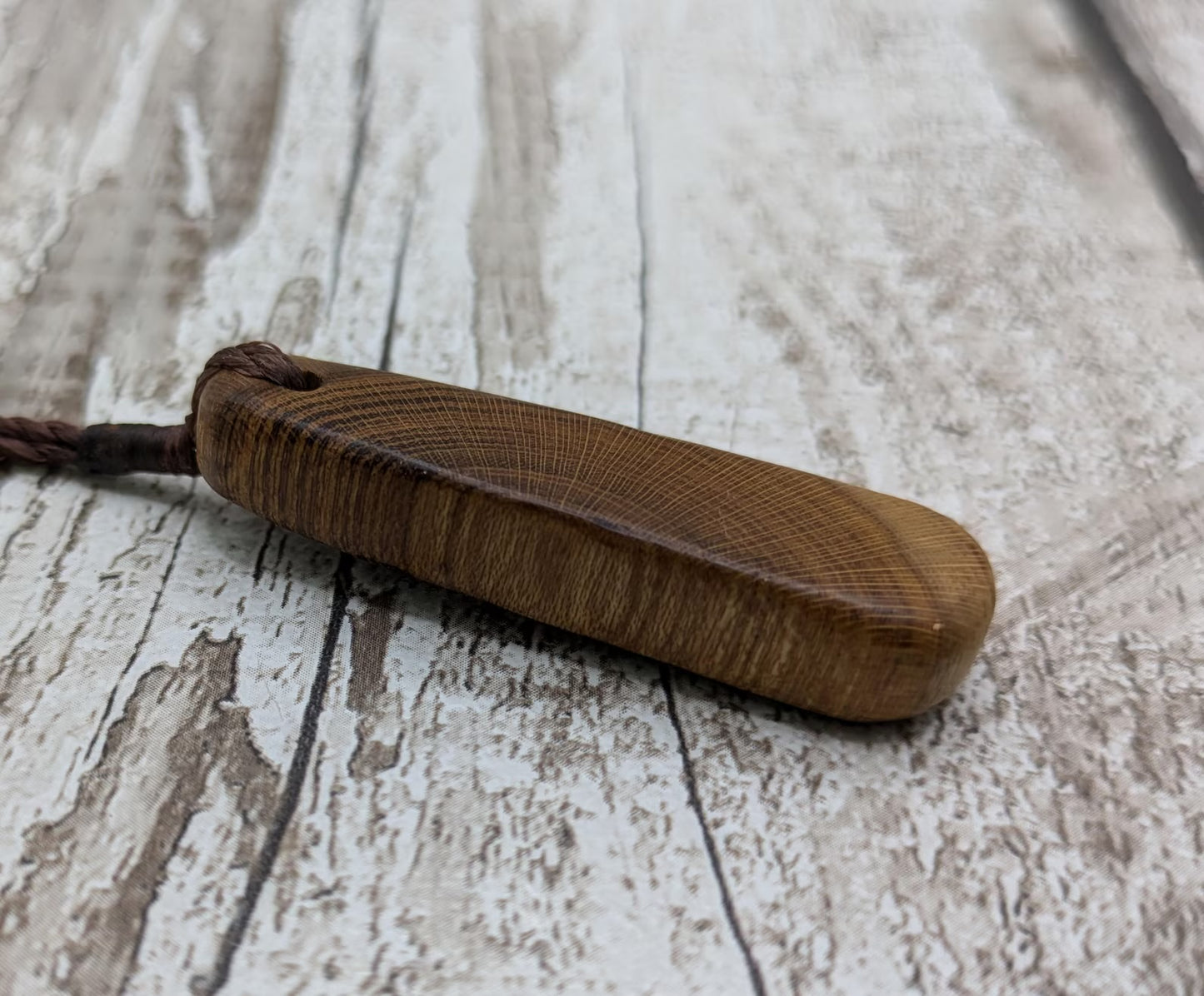 Laburnum wood roimata tear drop pendant.