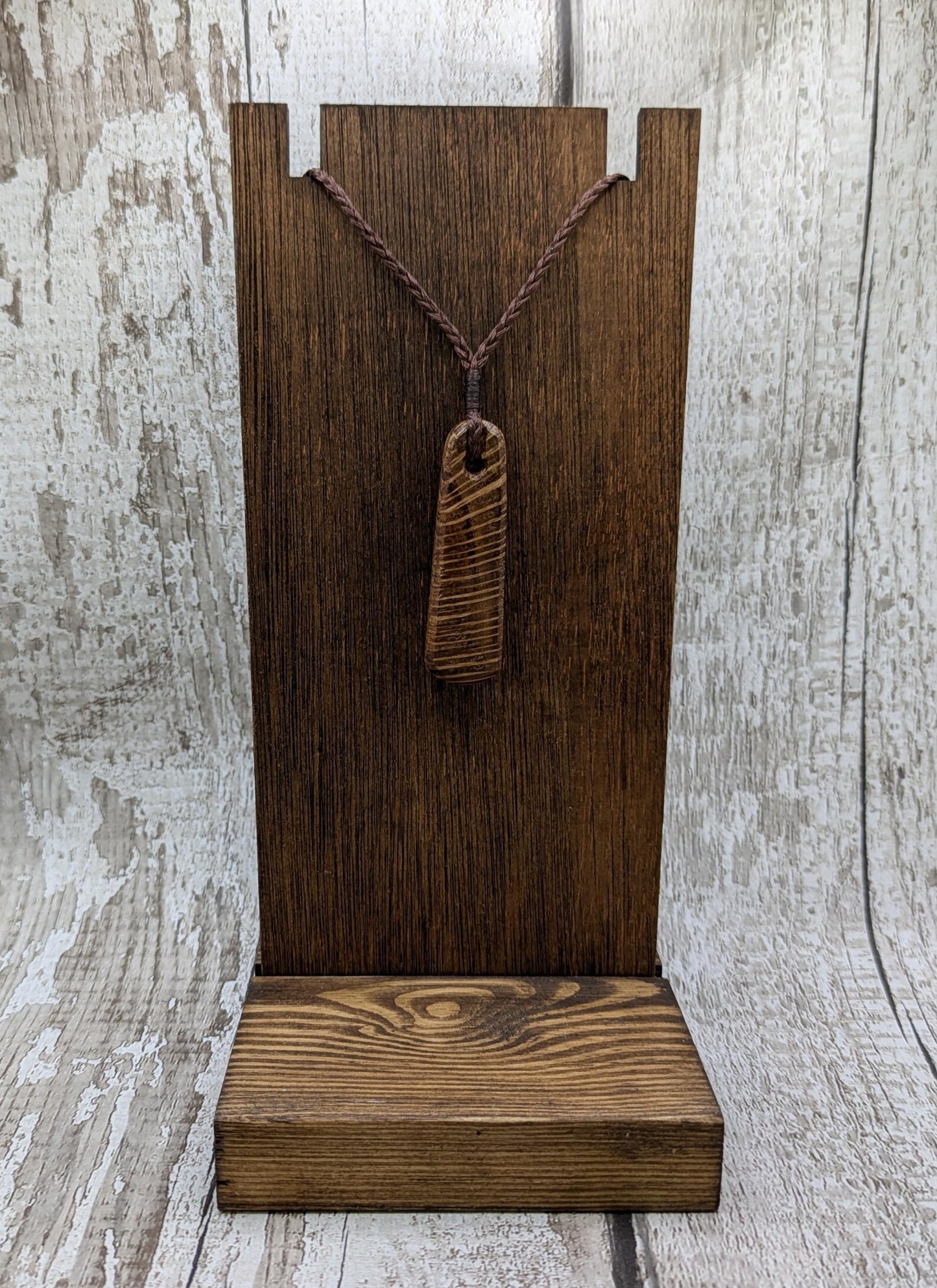 Olive wood roimata teardrop pendant.