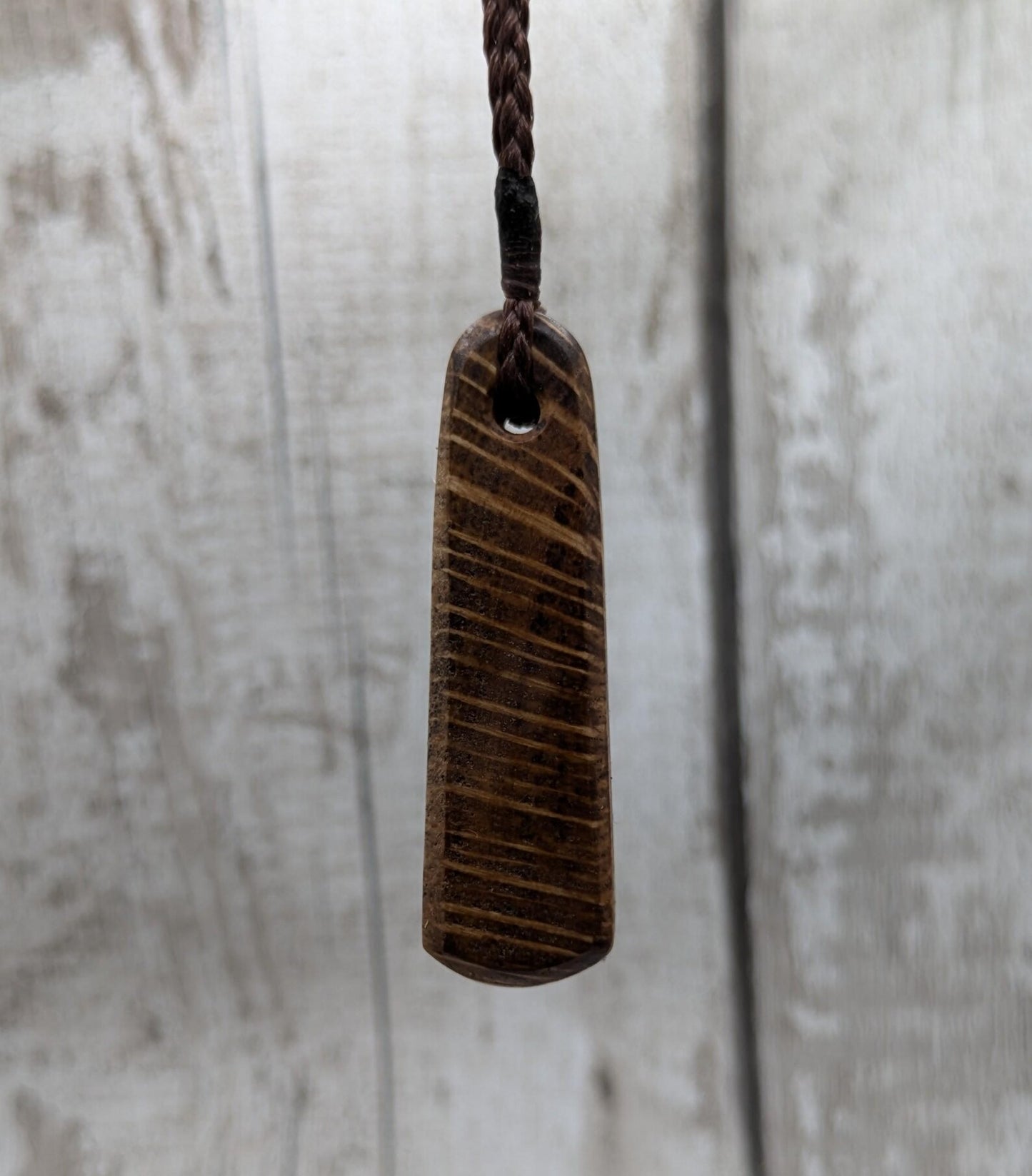 Olive wood roimata teardrop pendant.