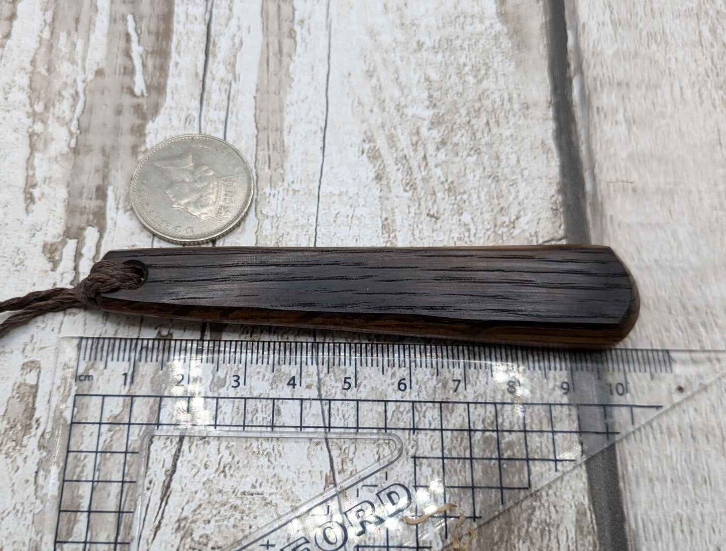 Whiskey barrel oak wood roimata teardrop pendant.