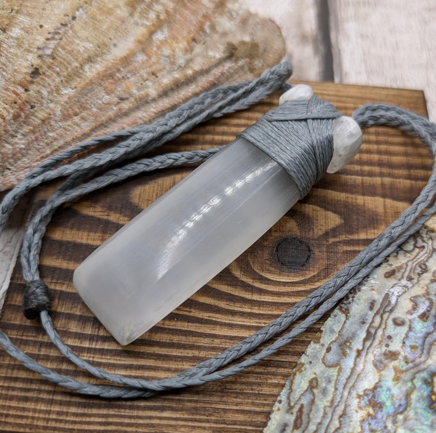 Selenite satin spar Hei Toki adze pendant.