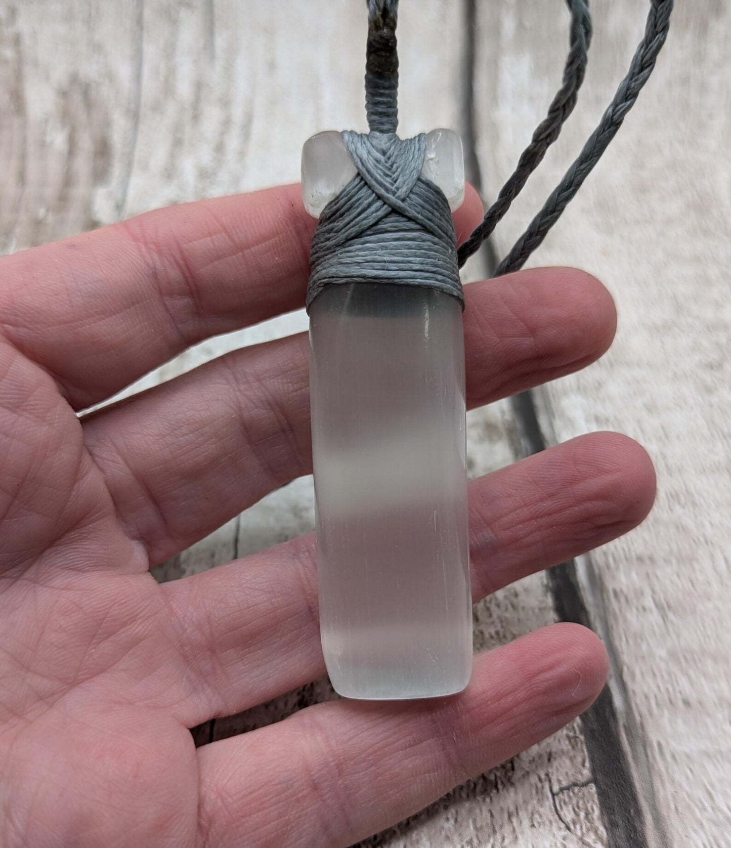 Selenite satin spar Hei Toki adze pendant.