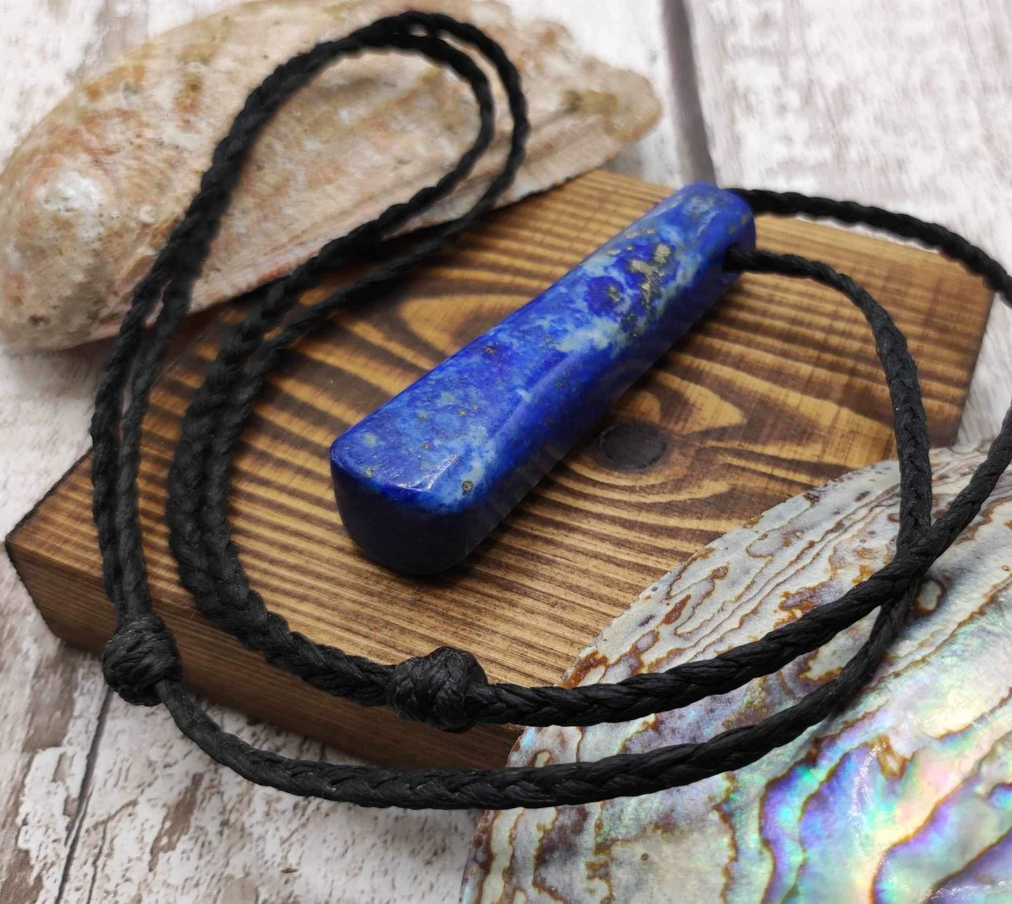Lapis lazuli roimata drop stone pendant.