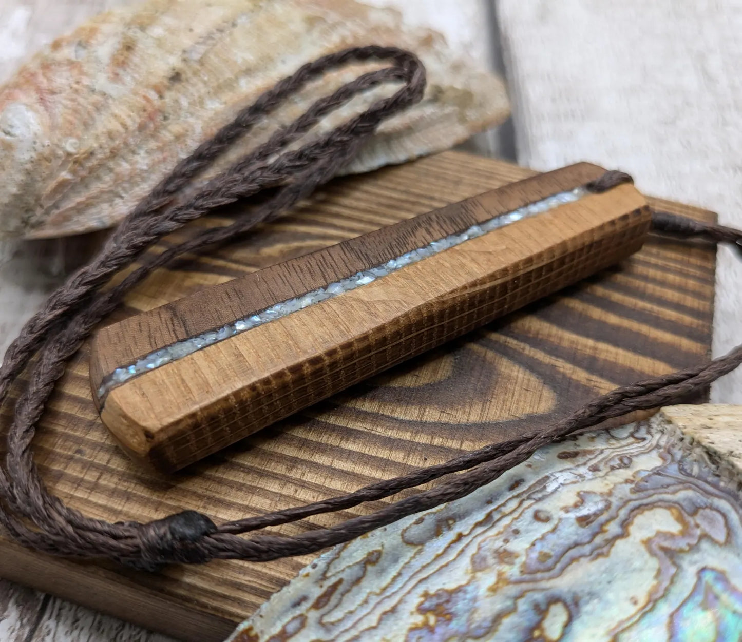 Walnut wood and whiskey barrel oak roimata pendant with freshwater Pearl.