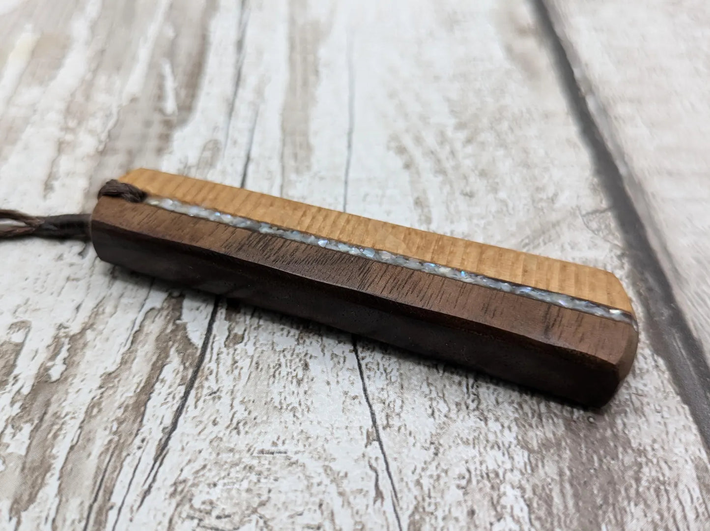 Walnut wood and whiskey barrel oak roimata pendant with freshwater Pearl.