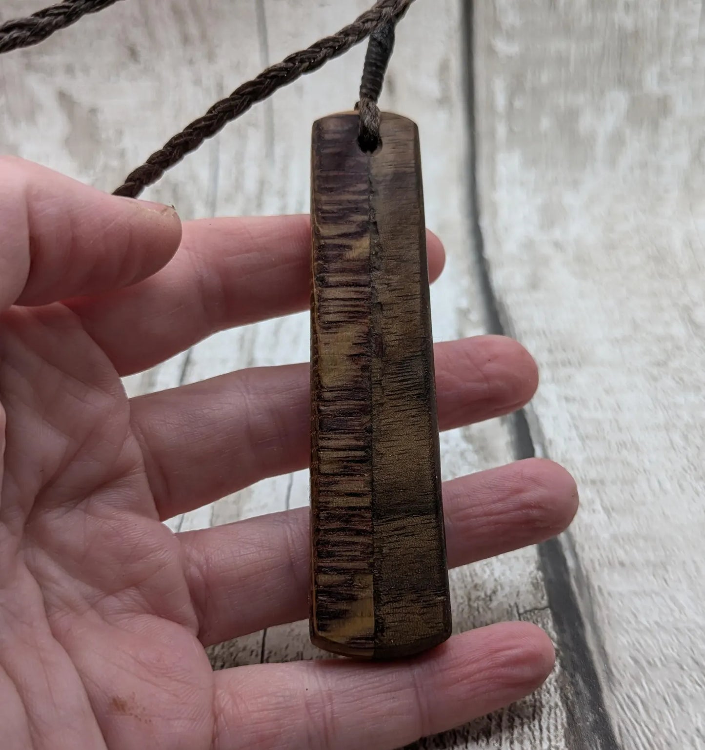 Walnut wood and whiskey barrel oak roimata pendant with freshwater Pearl.