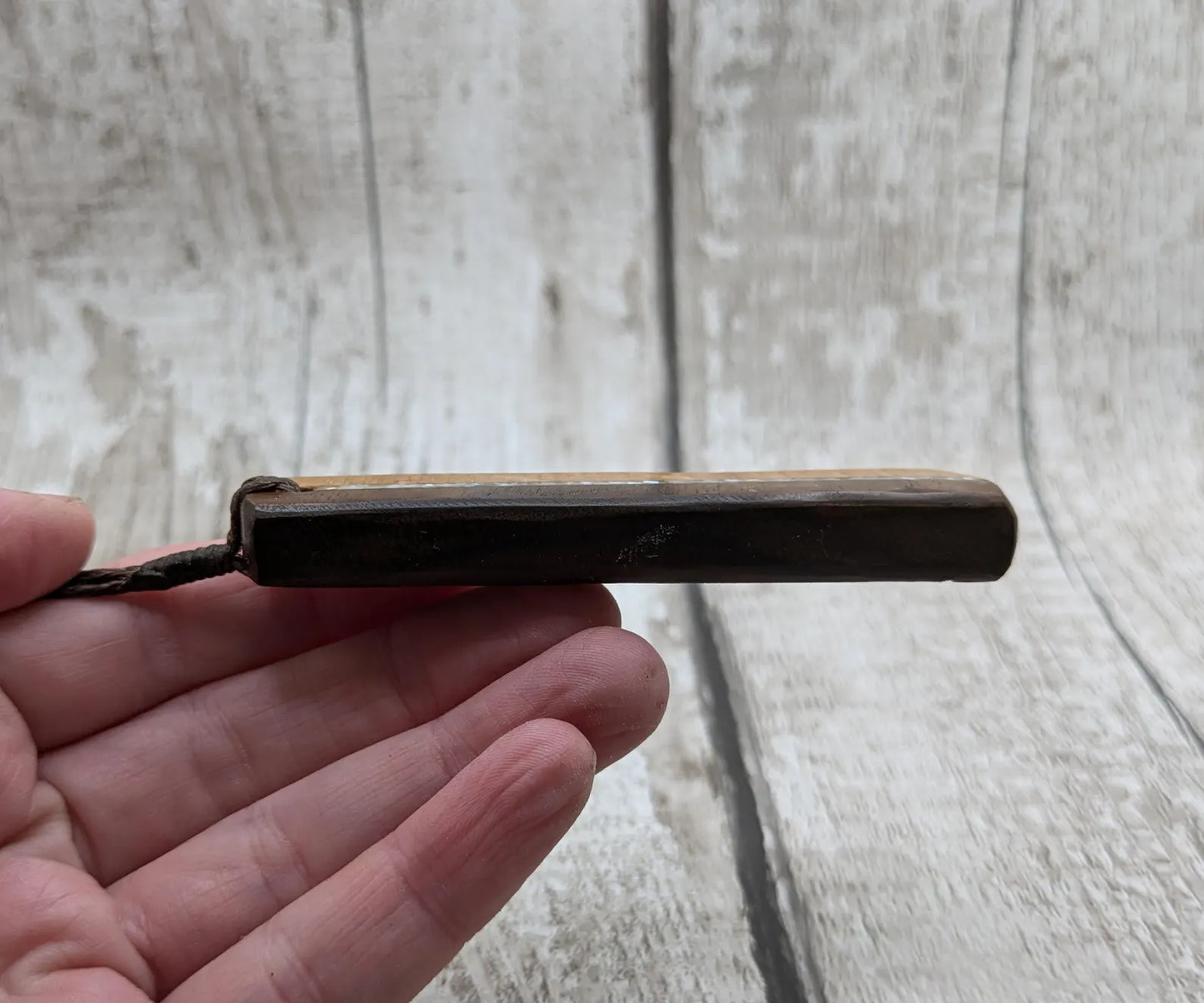Walnut wood and whiskey barrel oak roimata pendant with freshwater Pearl.