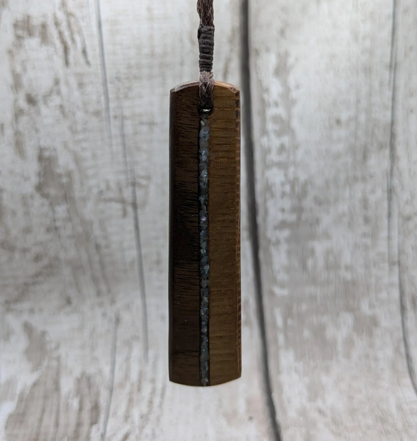 Walnut wood and whiskey barrel oak roimata pendant with freshwater Pearl.