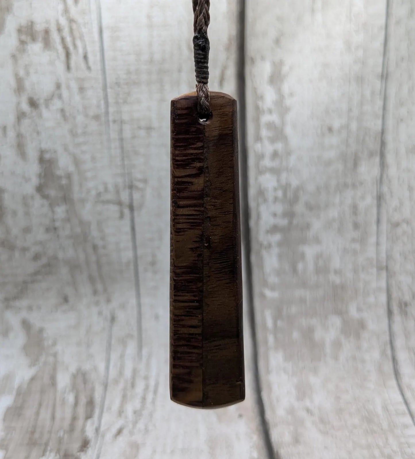 Walnut wood and whiskey barrel oak roimata pendant with freshwater Pearl.