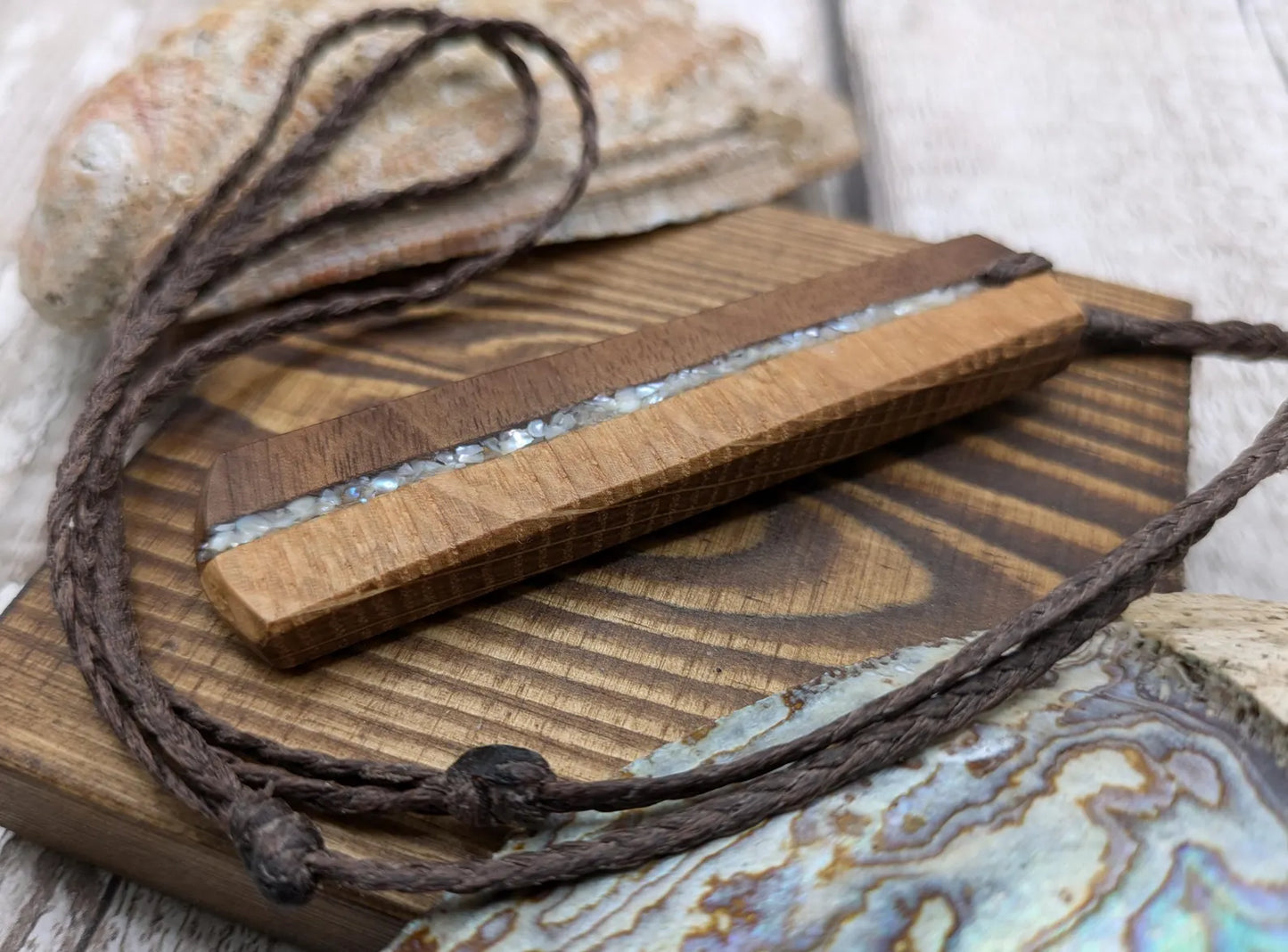 Walnut wood and whiskey barrel oak roimata pendant with freshwater Pearl.