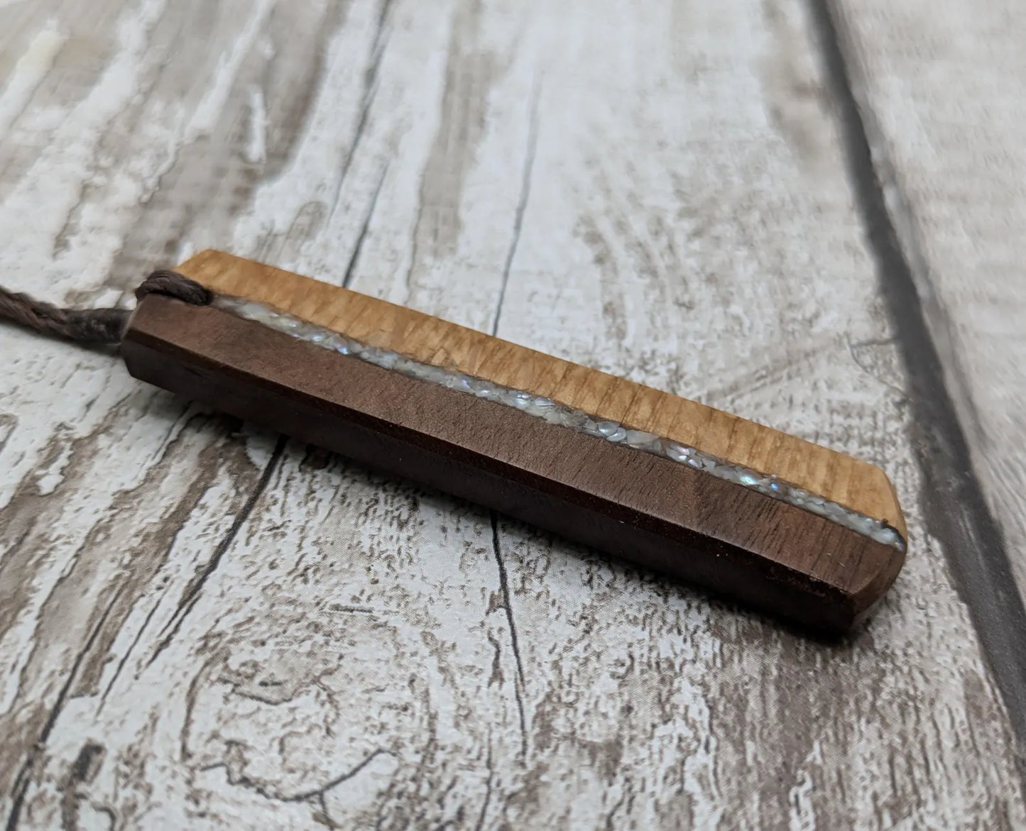 Walnut wood and whiskey barrel oak roimata pendant with freshwater Pearl.
