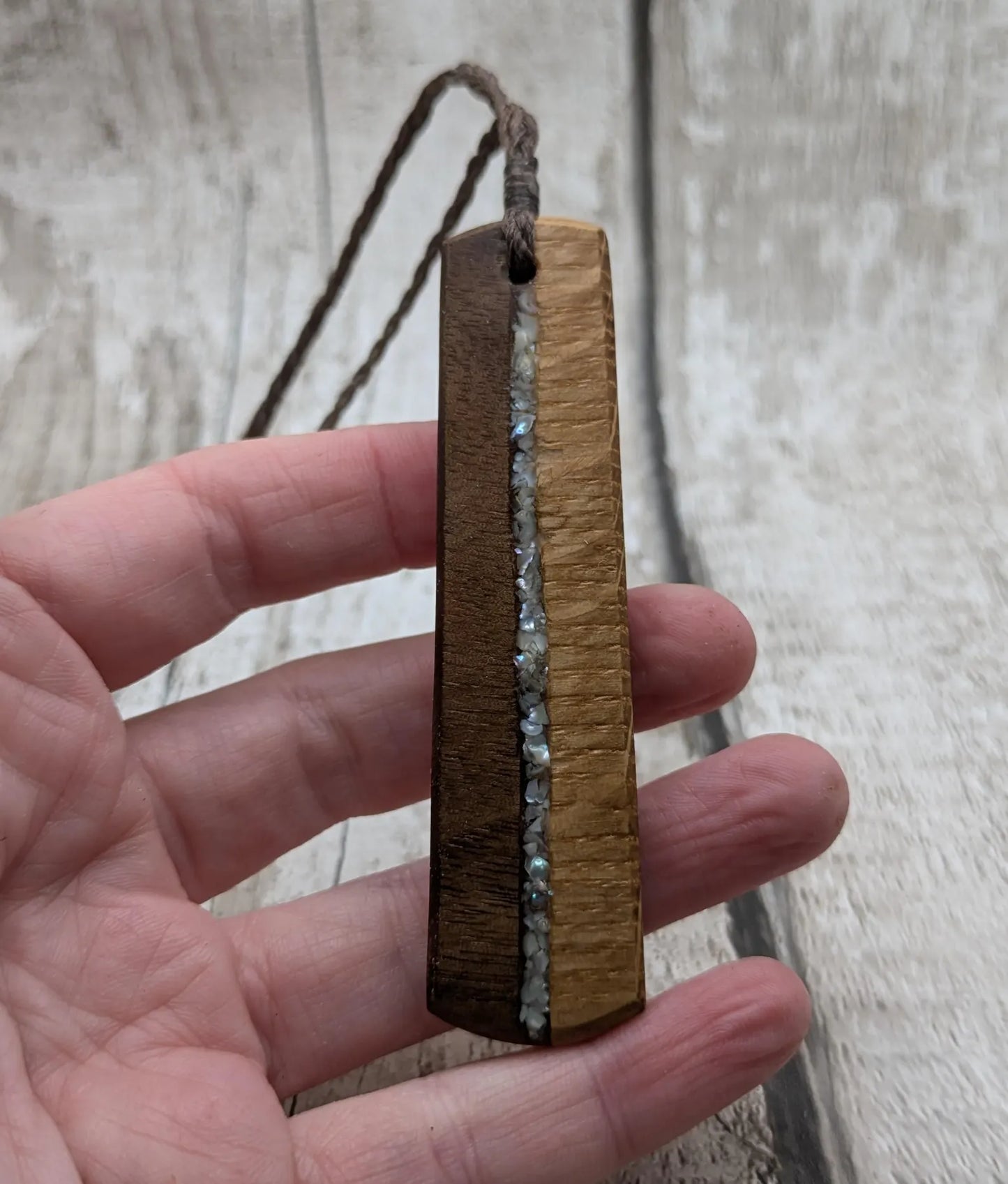 Walnut wood and whiskey barrel oak roimata pendant with freshwater Pearl.
