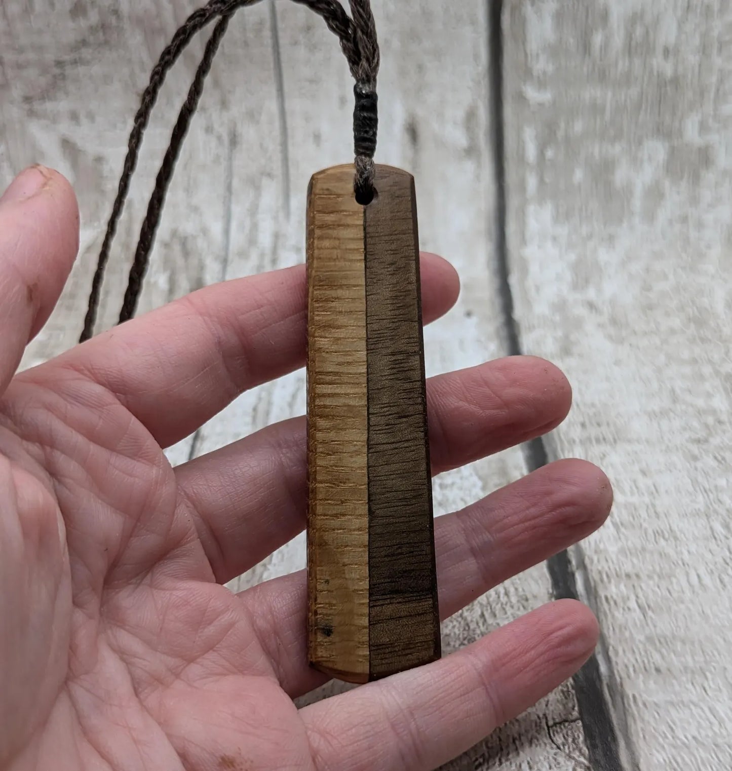 Walnut wood and whiskey barrel oak roimata pendant with freshwater Pearl.