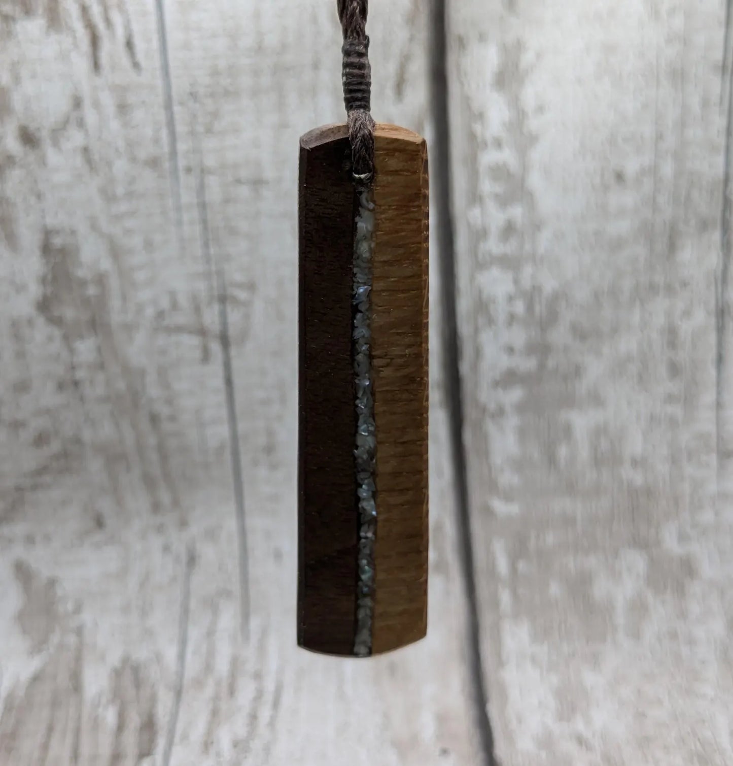 Walnut wood and whiskey barrel oak roimata pendant with freshwater Pearl.