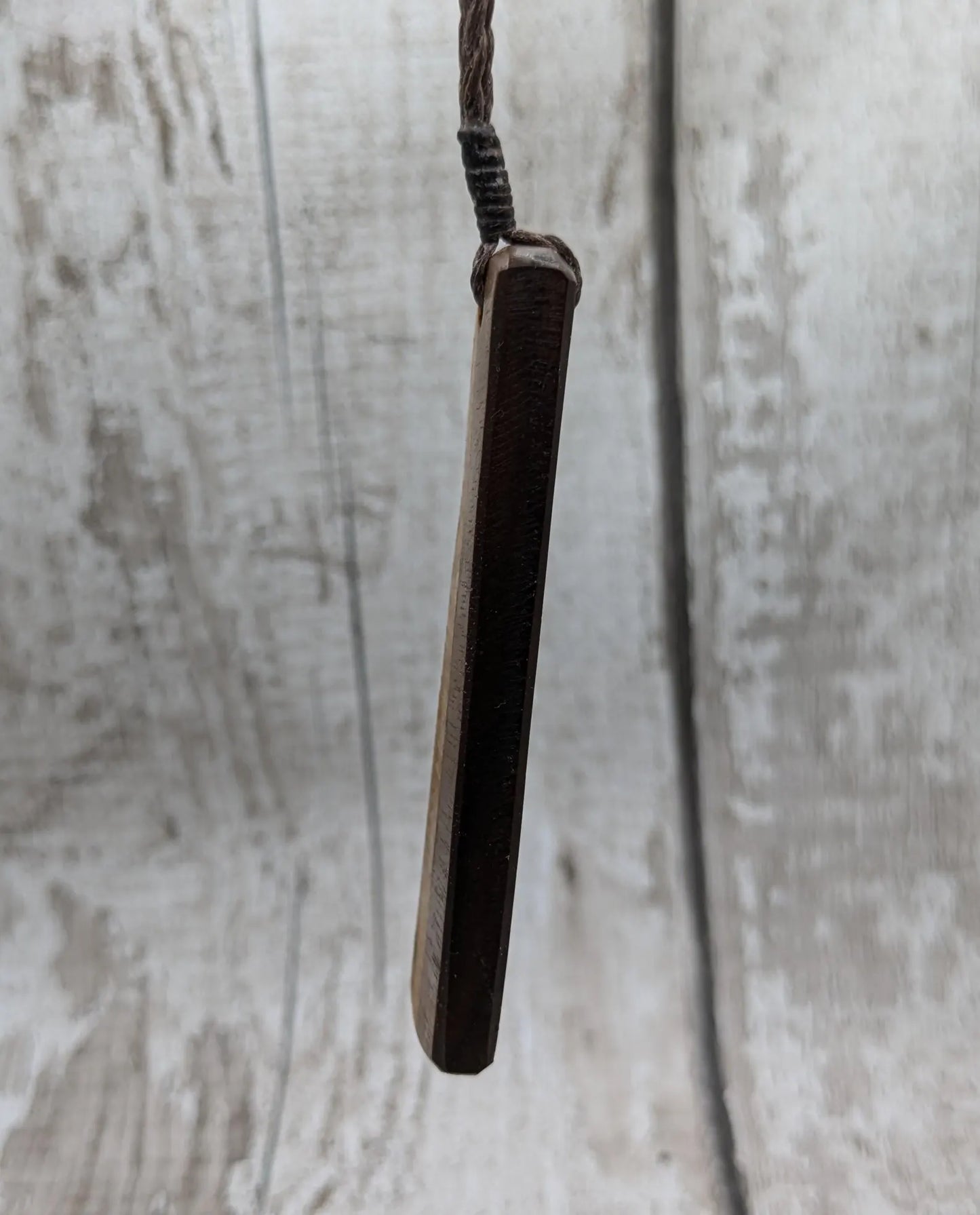 Walnut wood and whiskey barrel oak roimata pendant with freshwater Pearl.