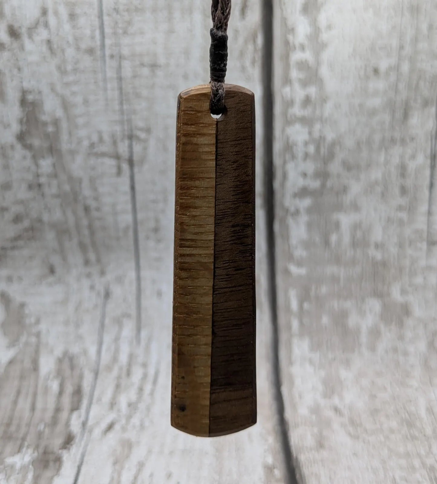Walnut wood and whiskey barrel oak roimata pendant with freshwater Pearl.