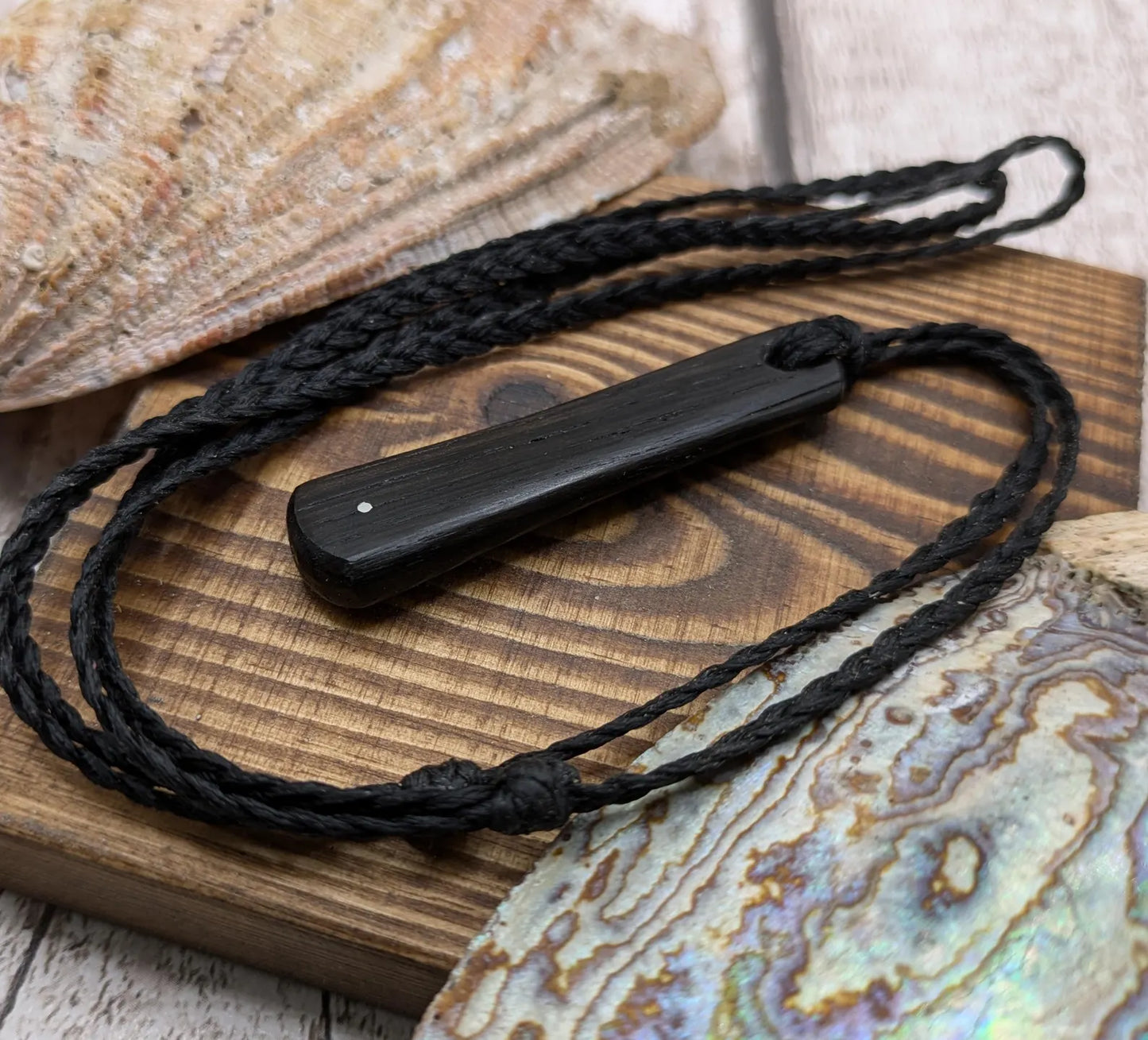 Fenland bog oak roimata drop pendant with 925 sterling silver dot.