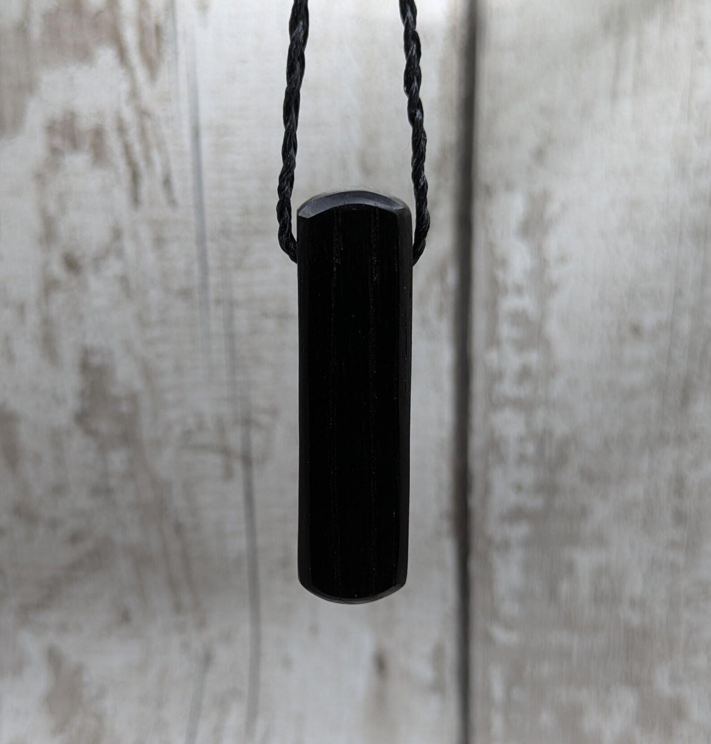Fenland bog oak roimata pendant with copper pin.