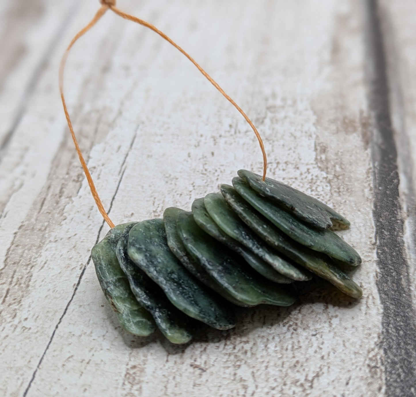 10 top drilled Pounamu greenstone jade beads.