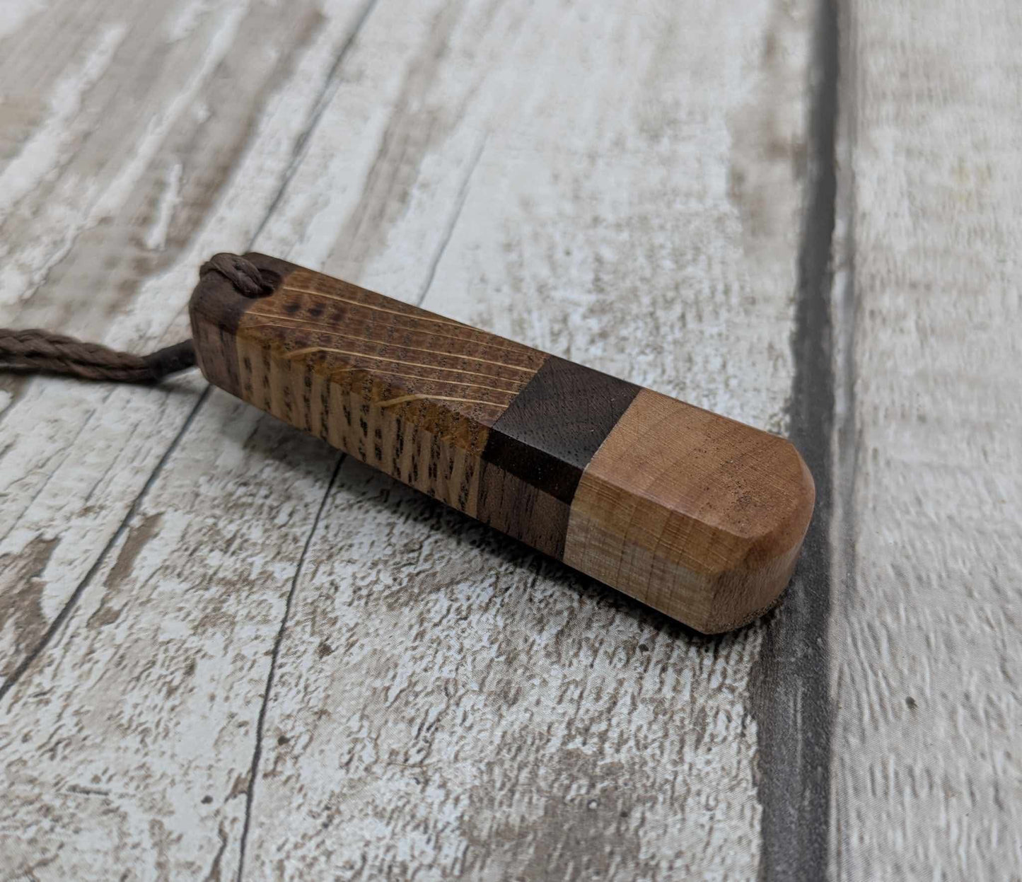 Triple wood roimata teardrop pendant.