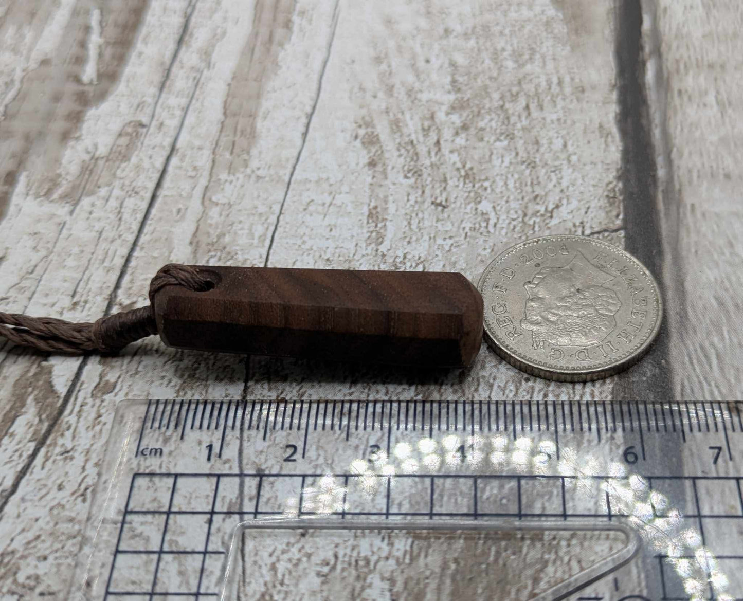 Walnut wood roimata tear drop pendant.