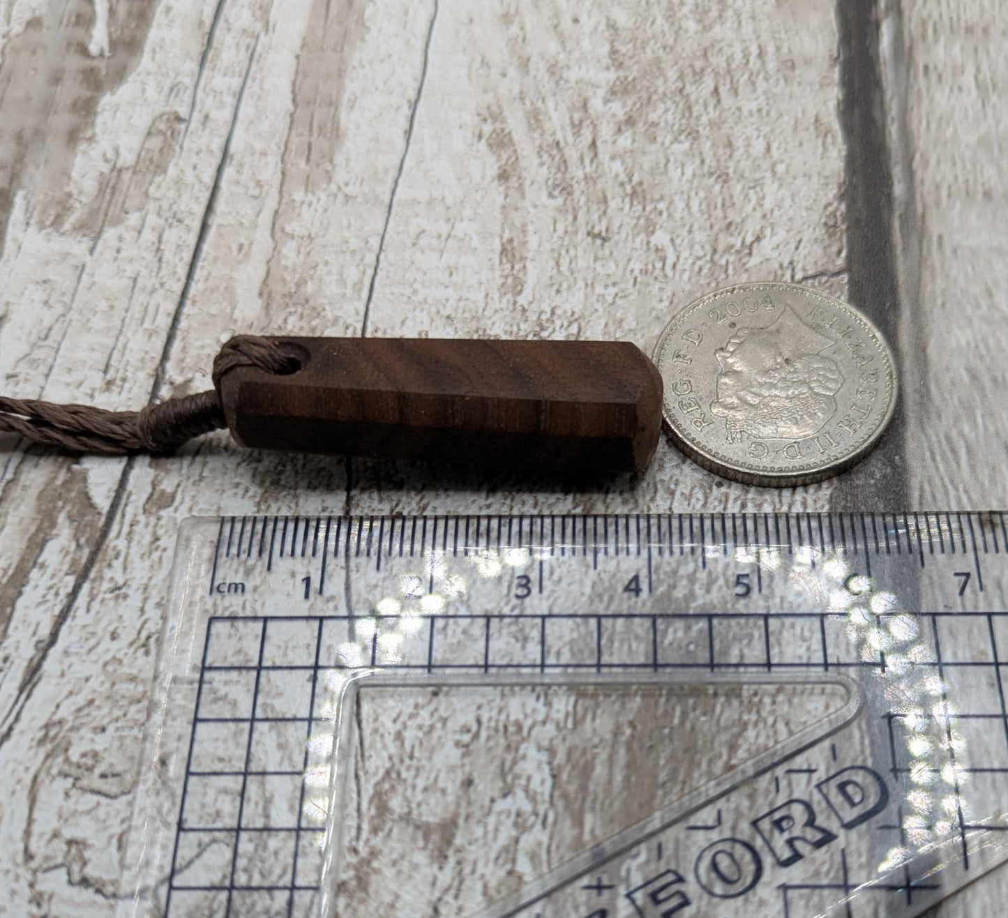Walnut wood roimata tear drop pendant.
