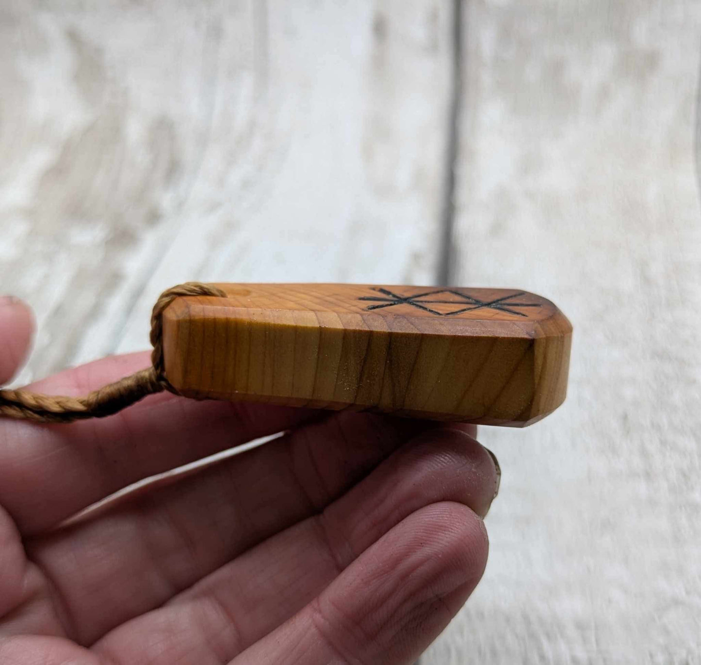 Yew wood roimata protection bind rune pendant.