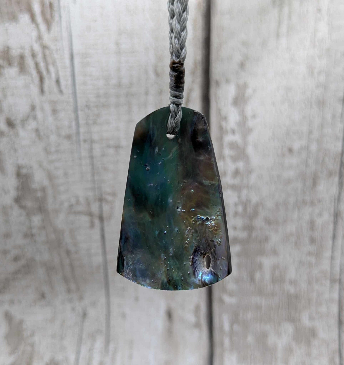 New Zealand pāua shell pendant.
