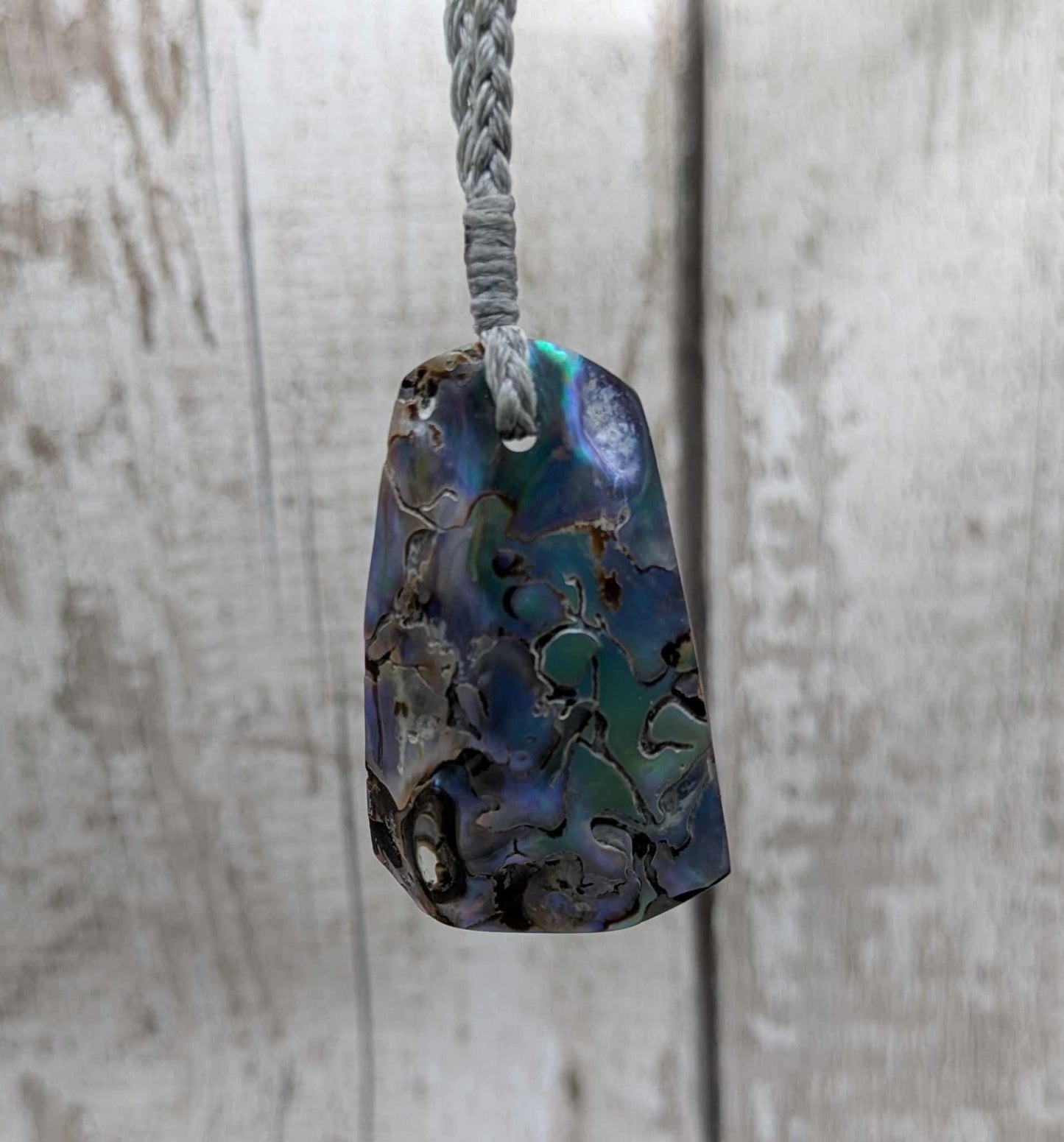 New Zealand pāua shell pendant.