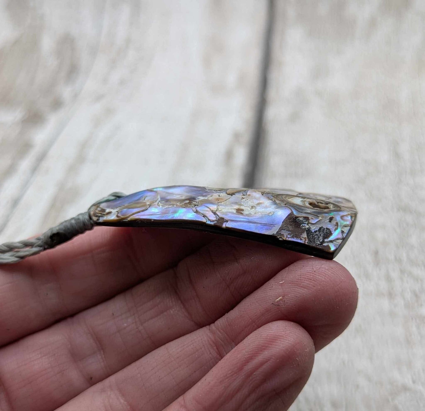 New Zealand pāua shell pendant.