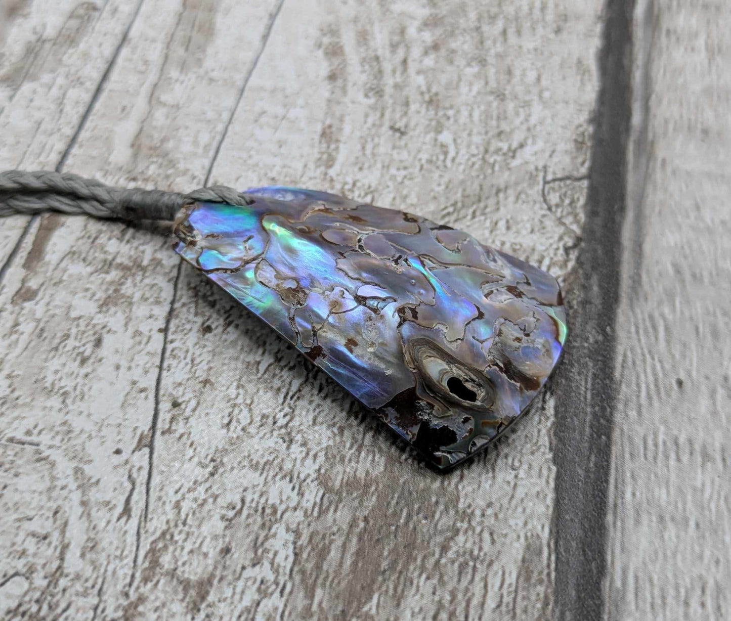 New Zealand pāua shell pendant.