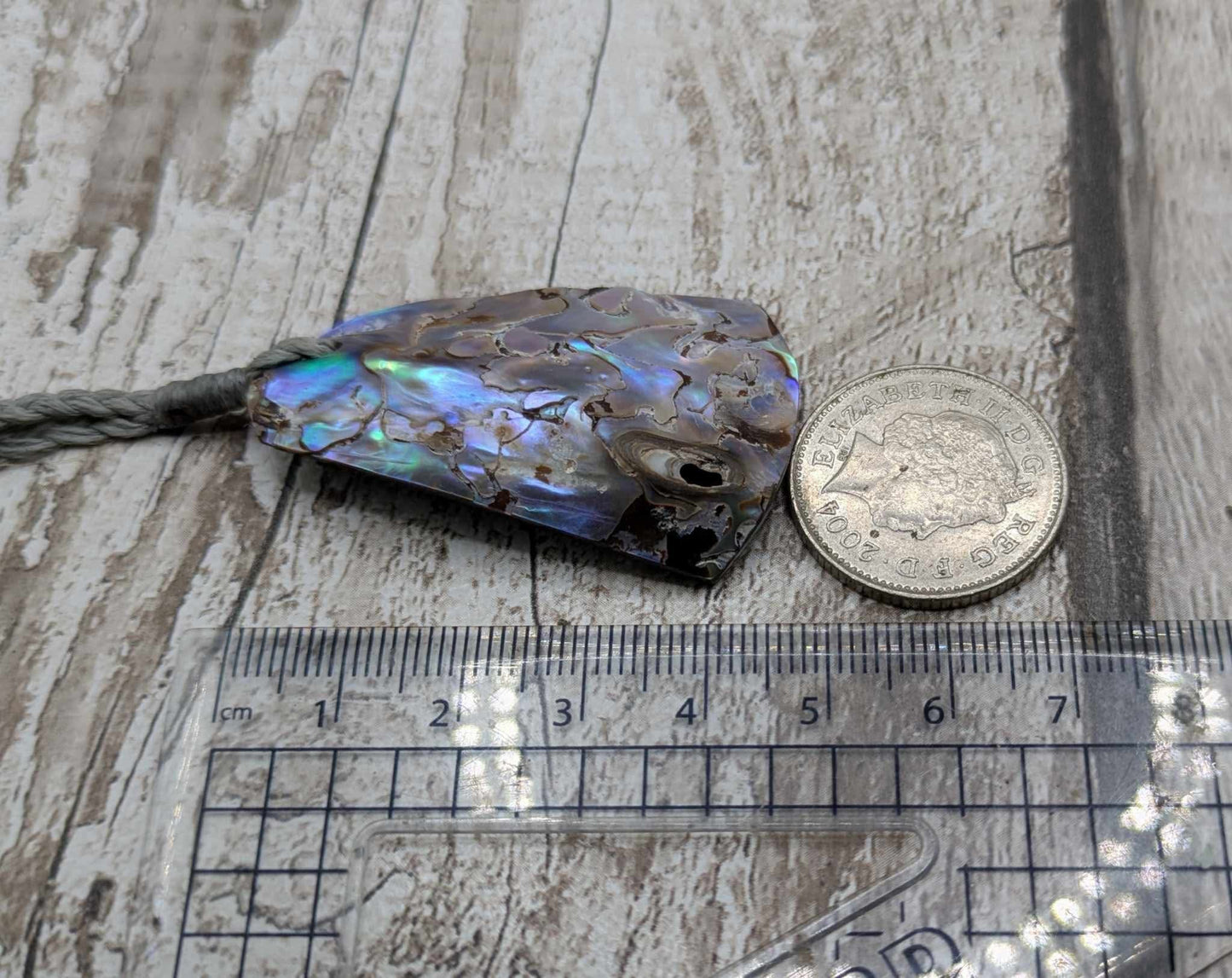 New Zealand pāua shell pendant.