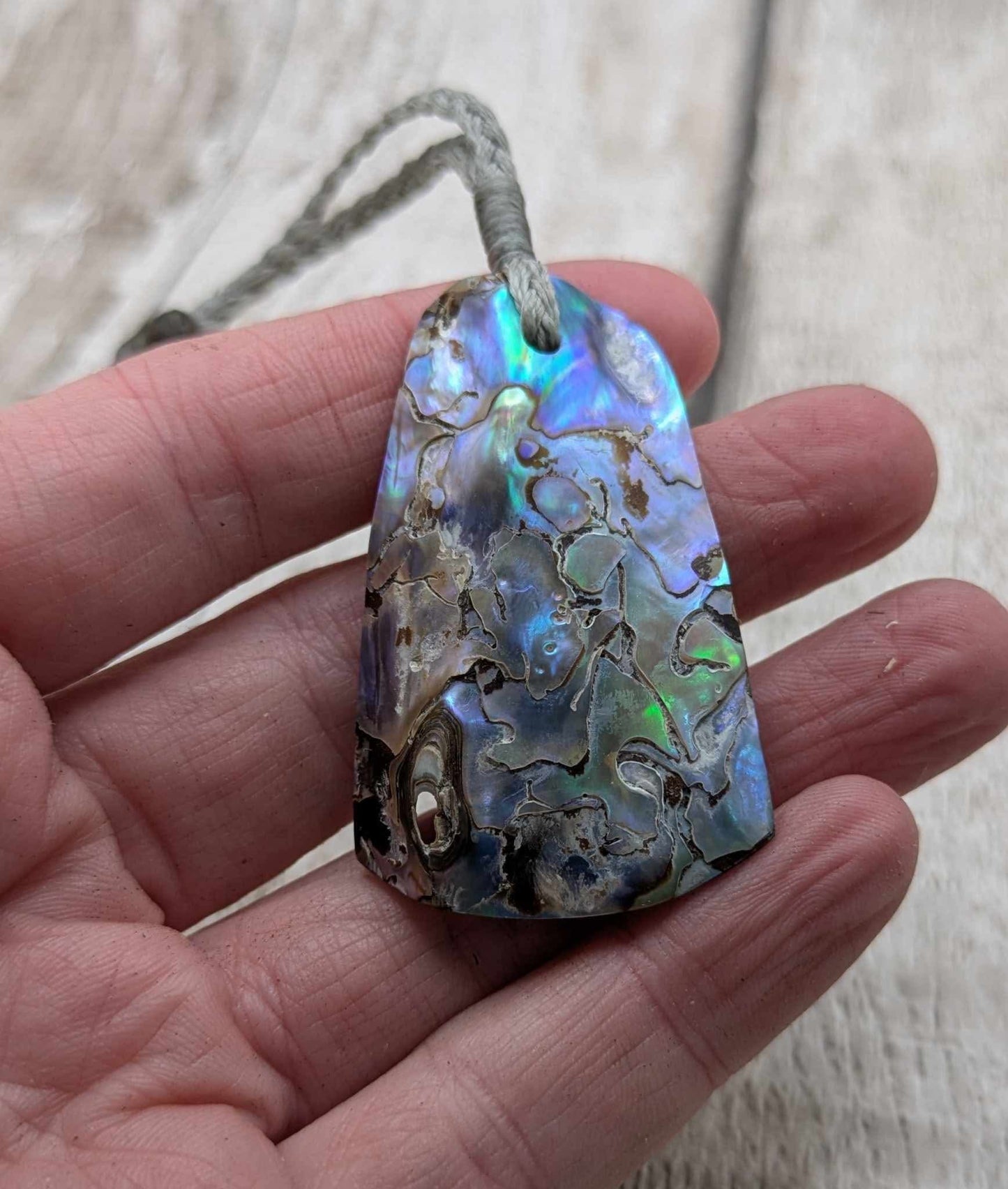 New Zealand pāua shell pendant.