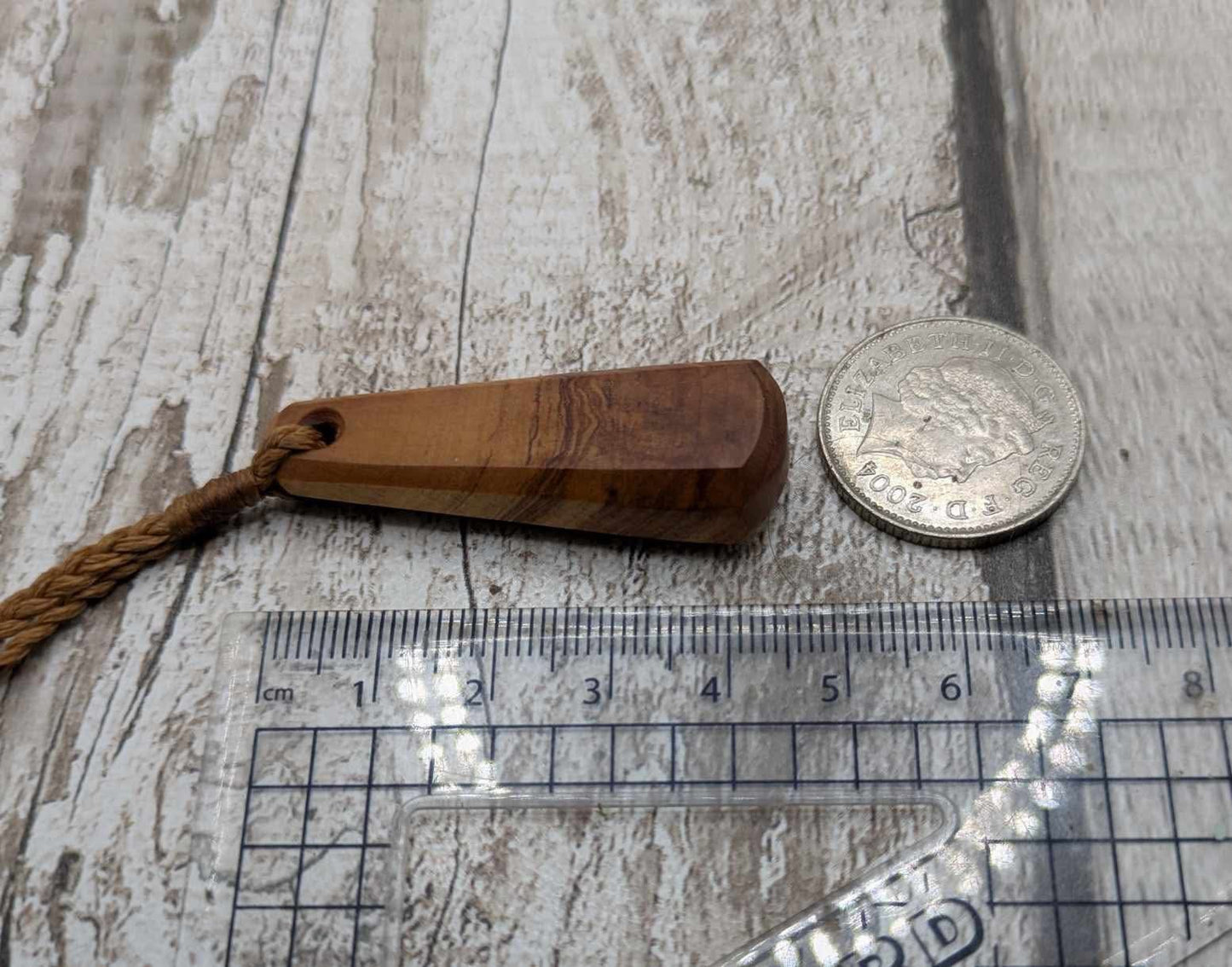 NZ Rimu wood roimata teardrop pendant.