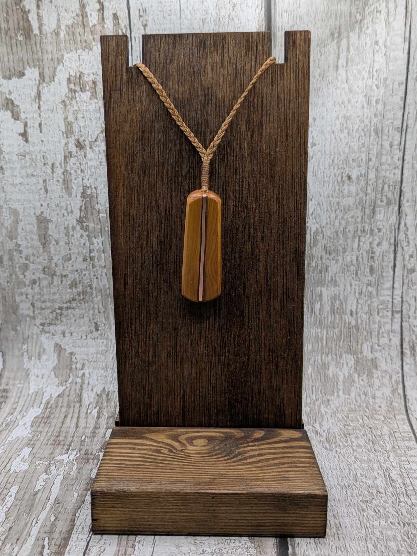 Yew wood roimata drop pendant with copper inlay.