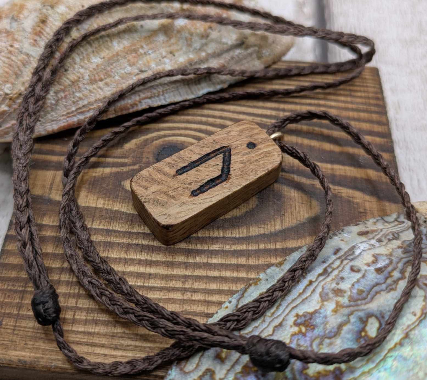 Olive wood uruz rune pendant.
