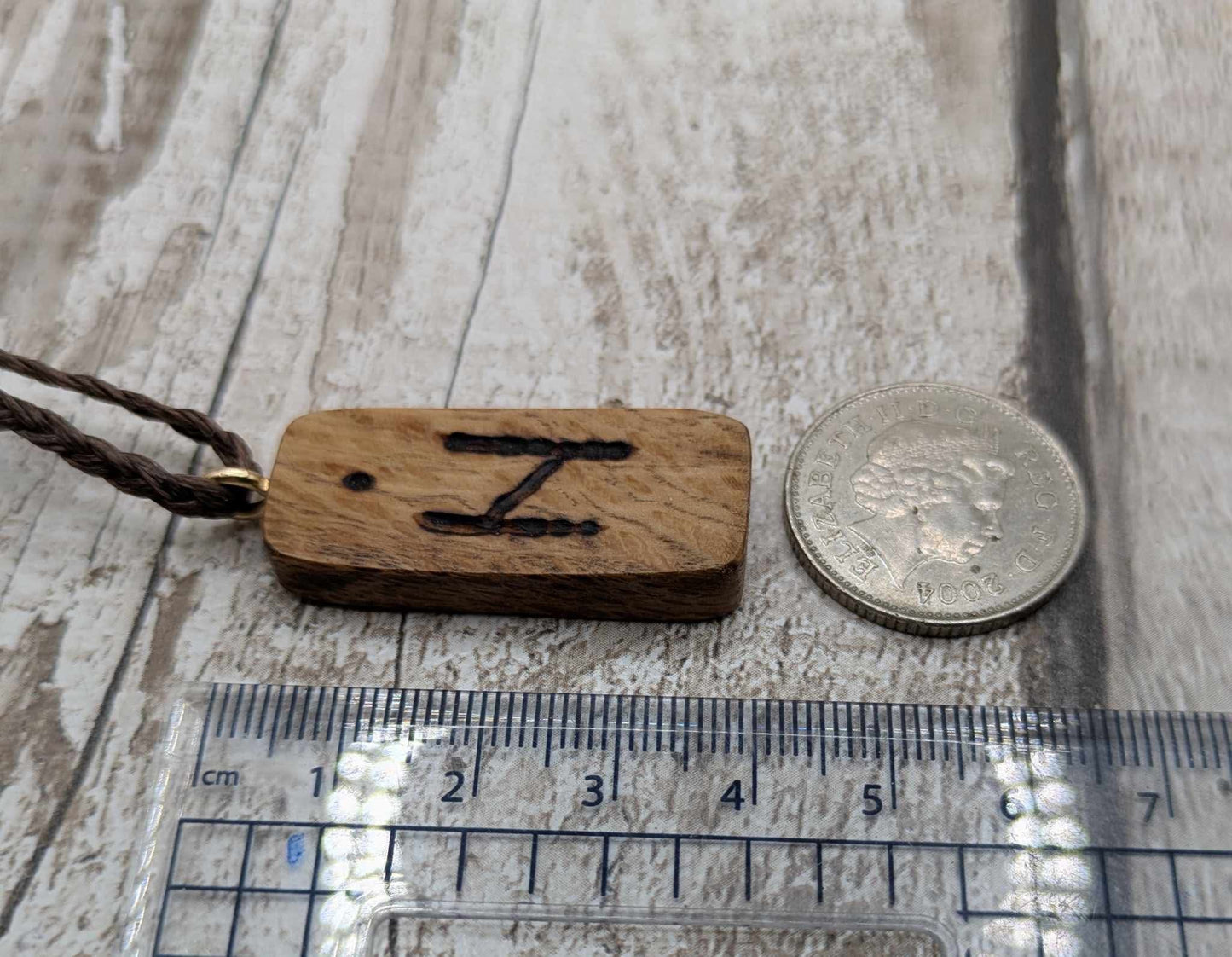 Olive wood hagalaz rune pendant.