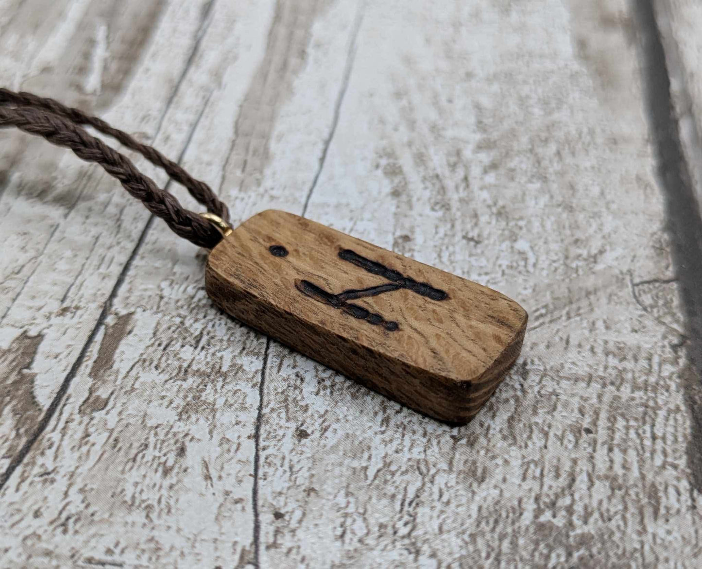 Olive wood hagalaz rune pendant.