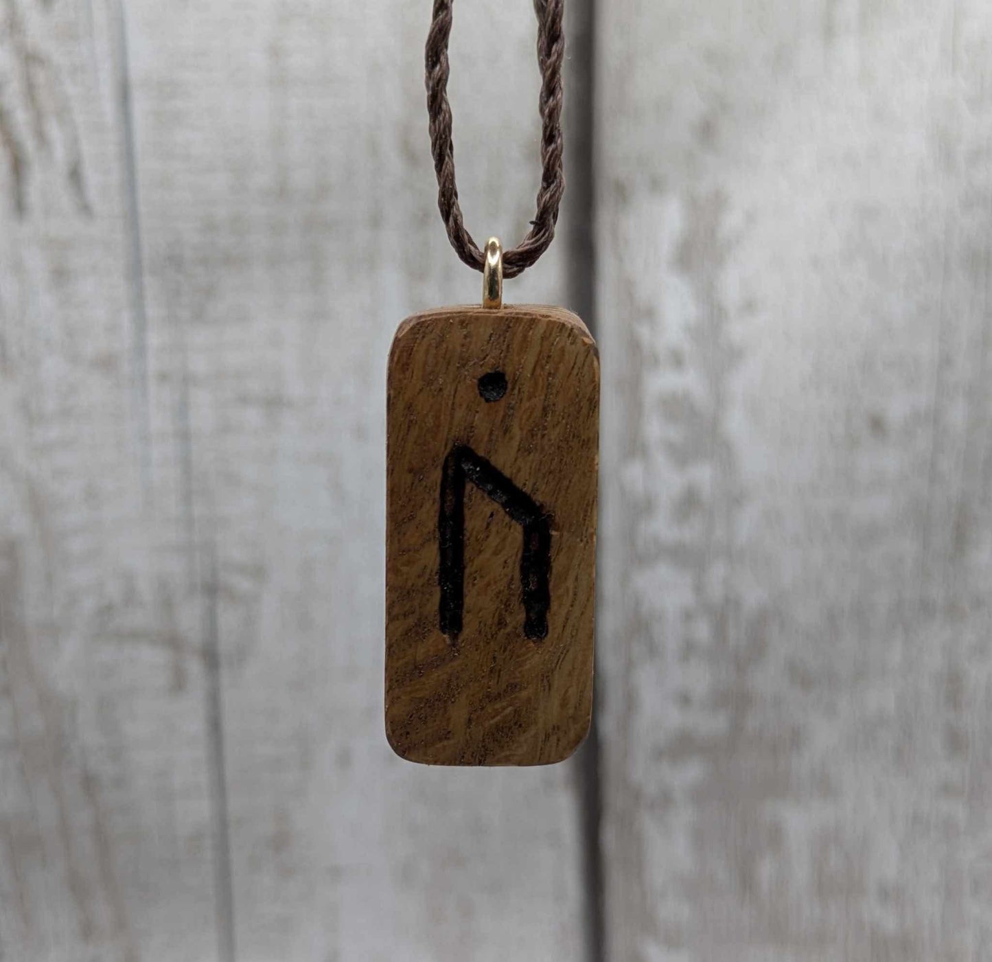Olive wood uruz rune pendant.