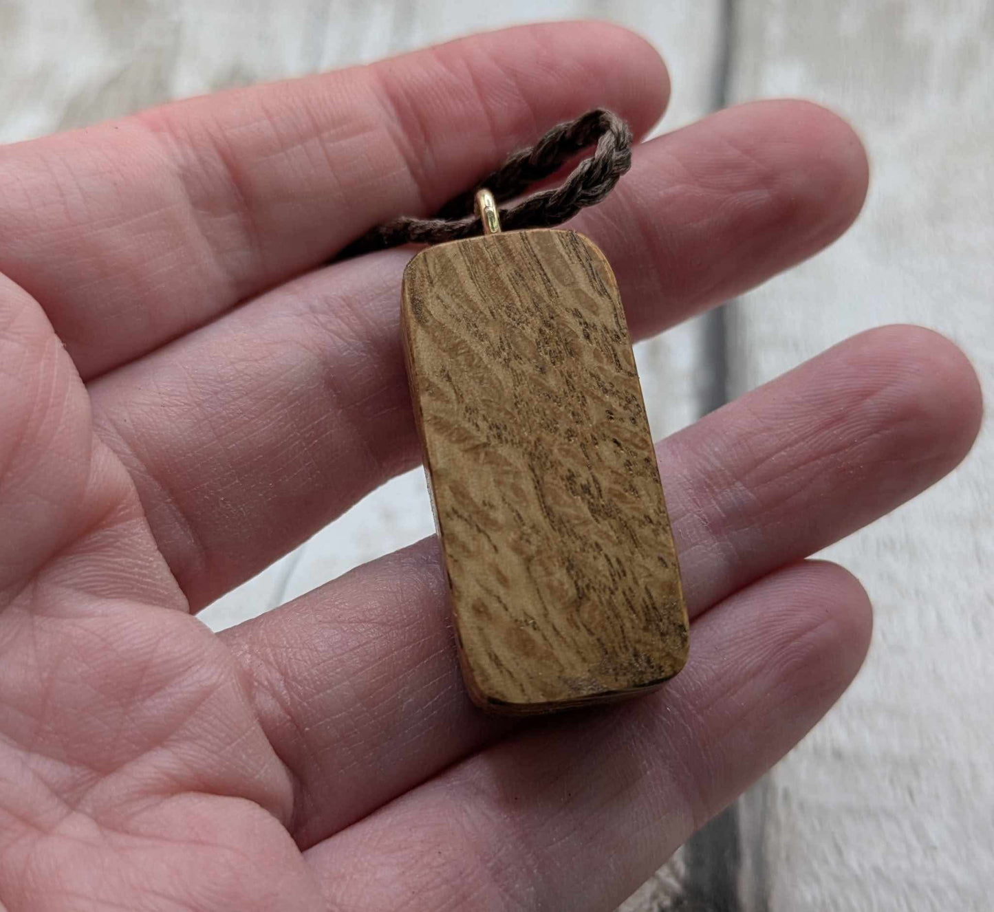 Olive wood uruz rune pendant.
