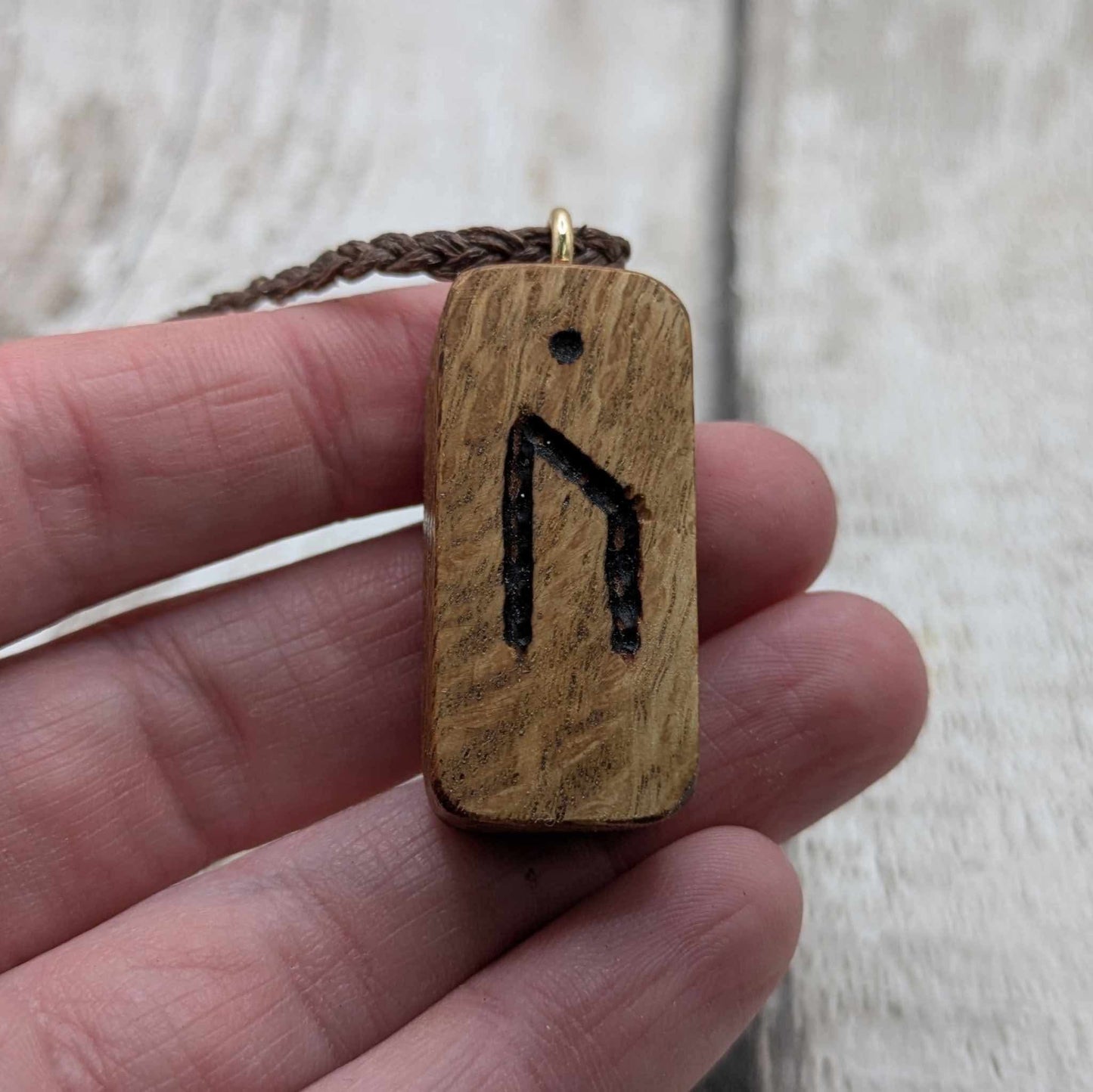 Olive wood uruz rune pendant.